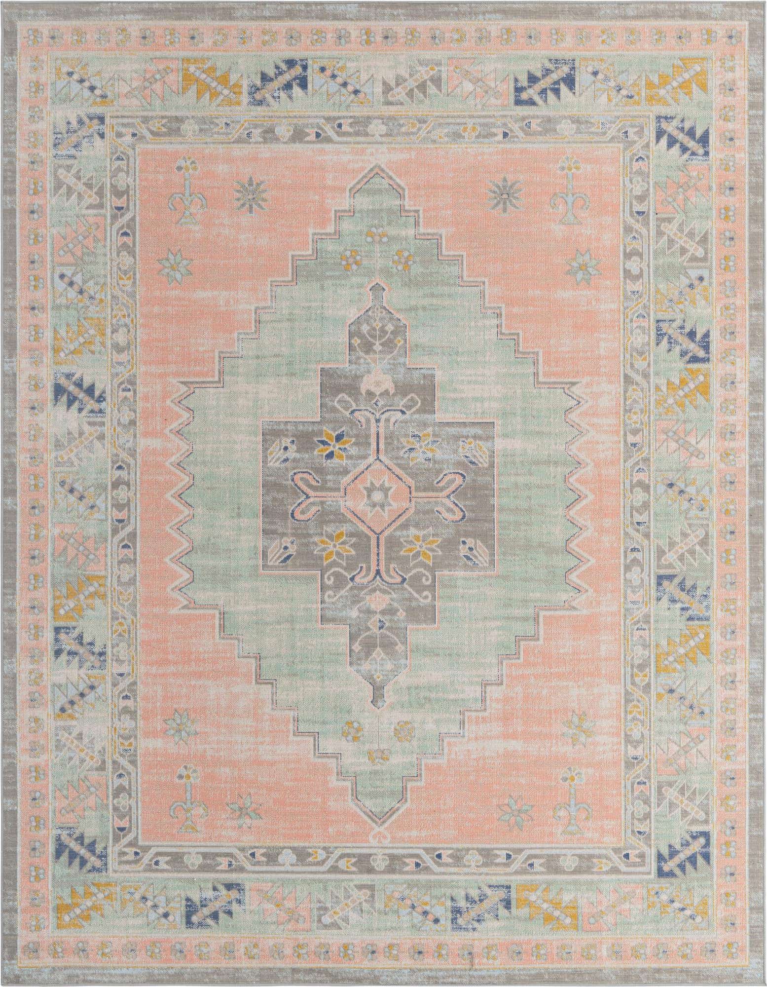 A 6x9 rectangular Rugs.com Whitney rug featuring a distressed pink field with a central mint green and gray medallion, framed by a tribal border.