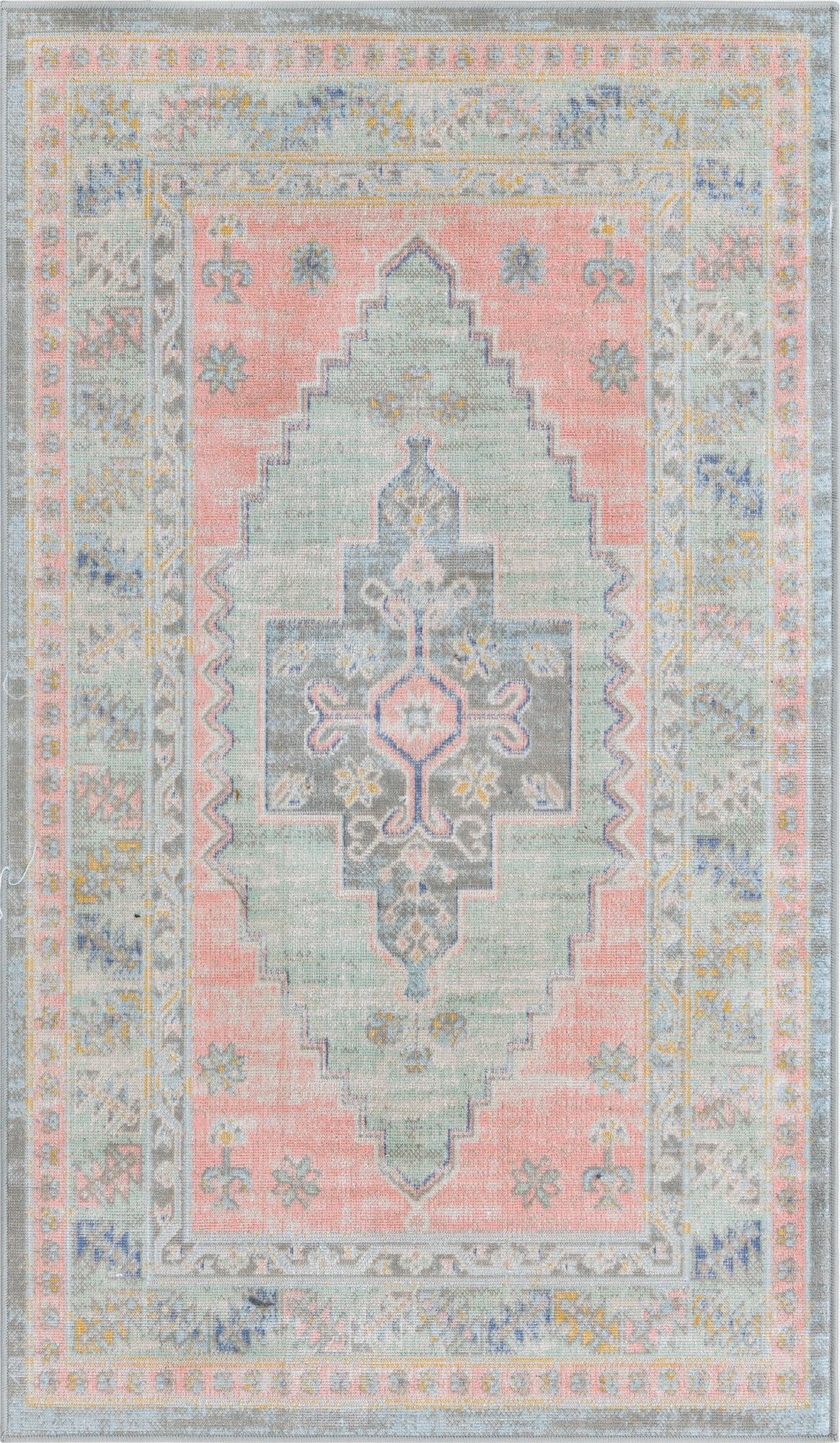 A 3x5 rectangular flatweave rug with a distressed pink background and a central medallion in faded teal, blue, and gray tribal patterns.