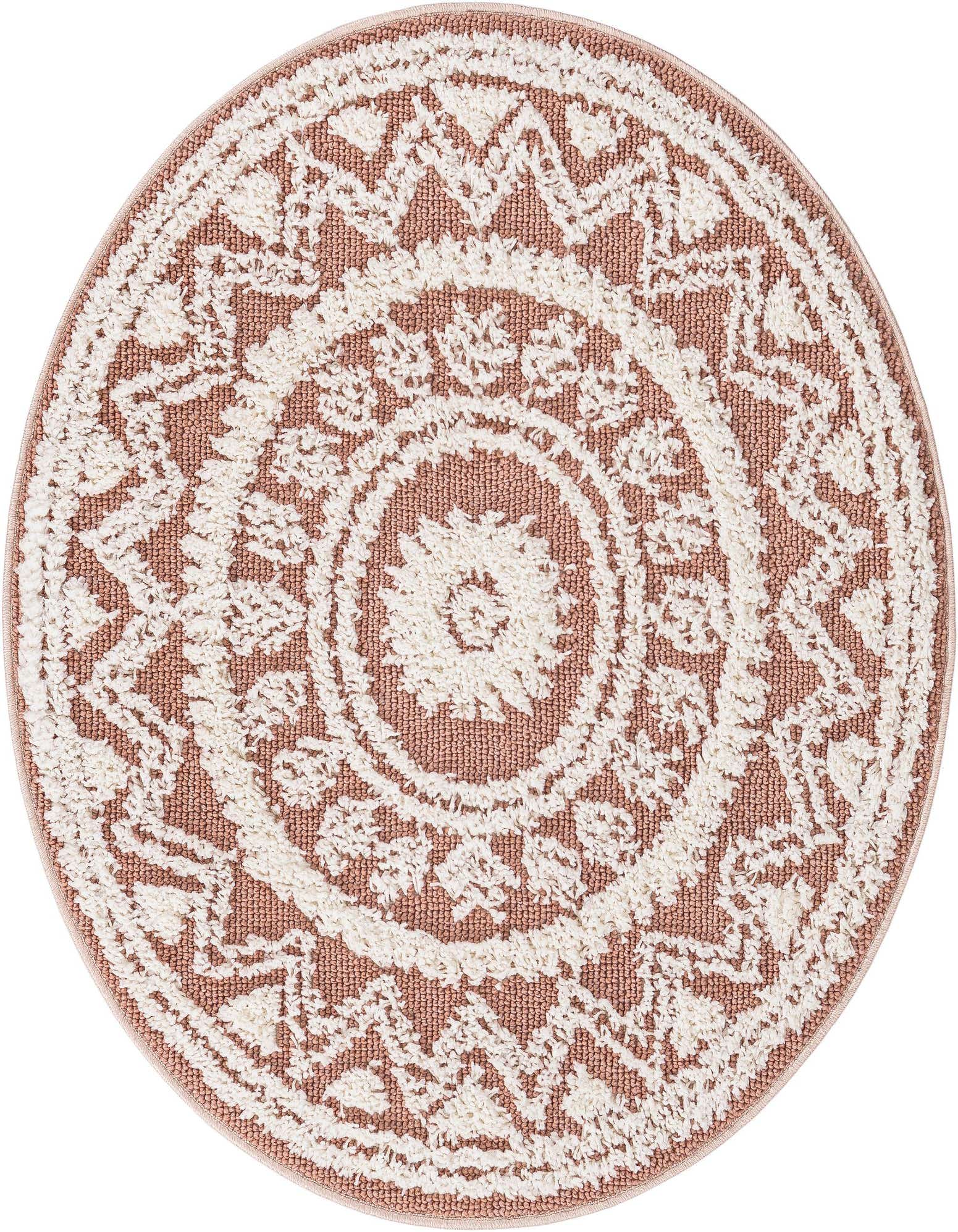 A 3' 3 round pink rug with a textured cream Southwestern medallion and tribal pattern, suitable for indoor use.