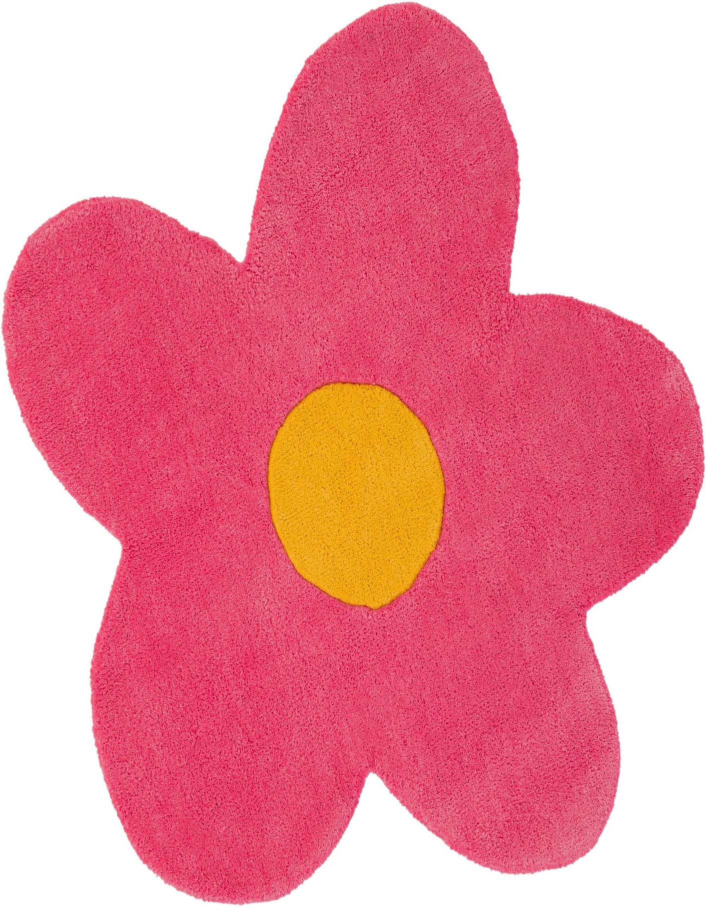 A vibrant pink flower-shaped rug with a bright yellow center, made of soft, high-pile wool.