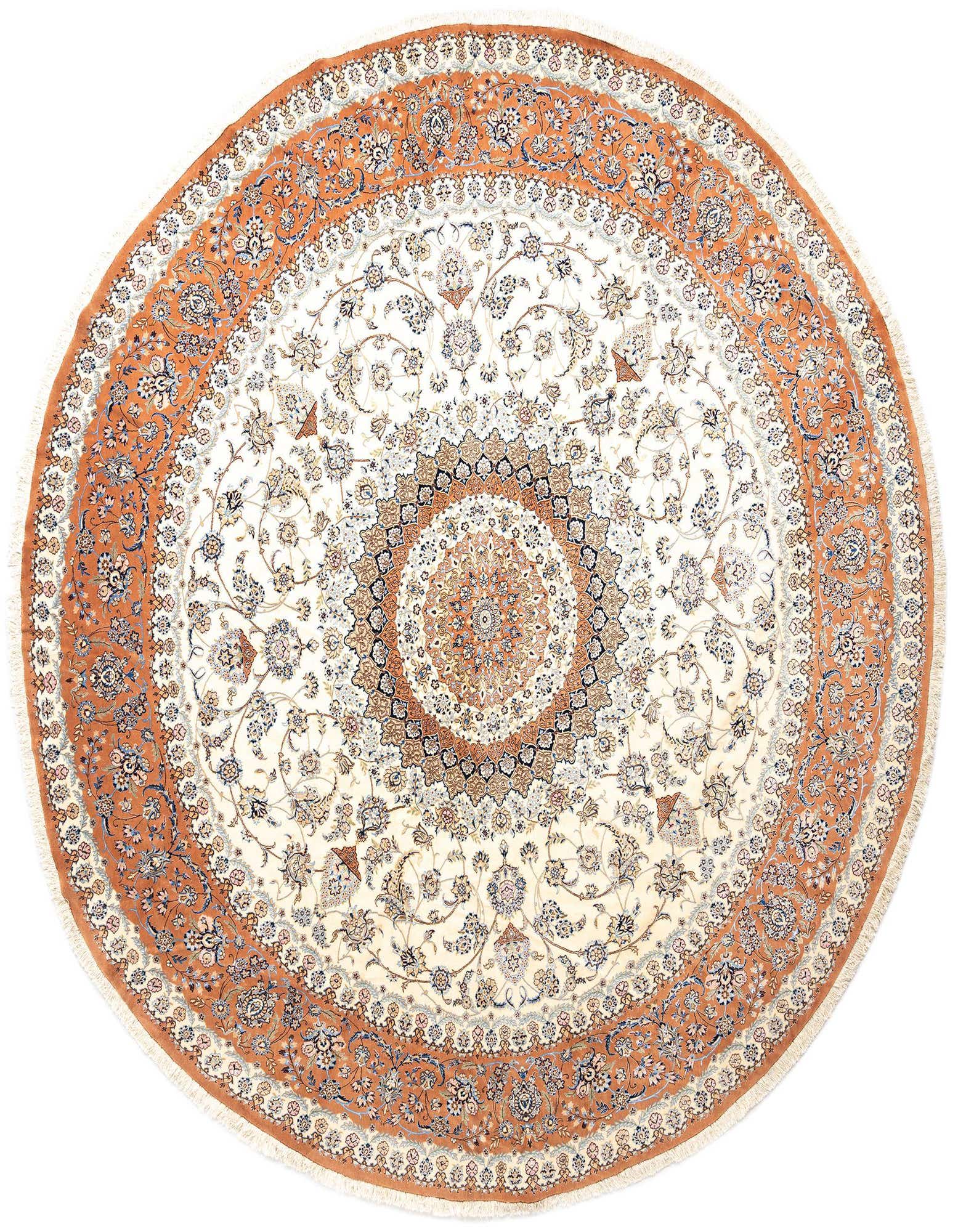 A large round Persian rug, 13' 9 x 13' 9, featuring intricate floral patterns in shades of pink, cream, and blue.