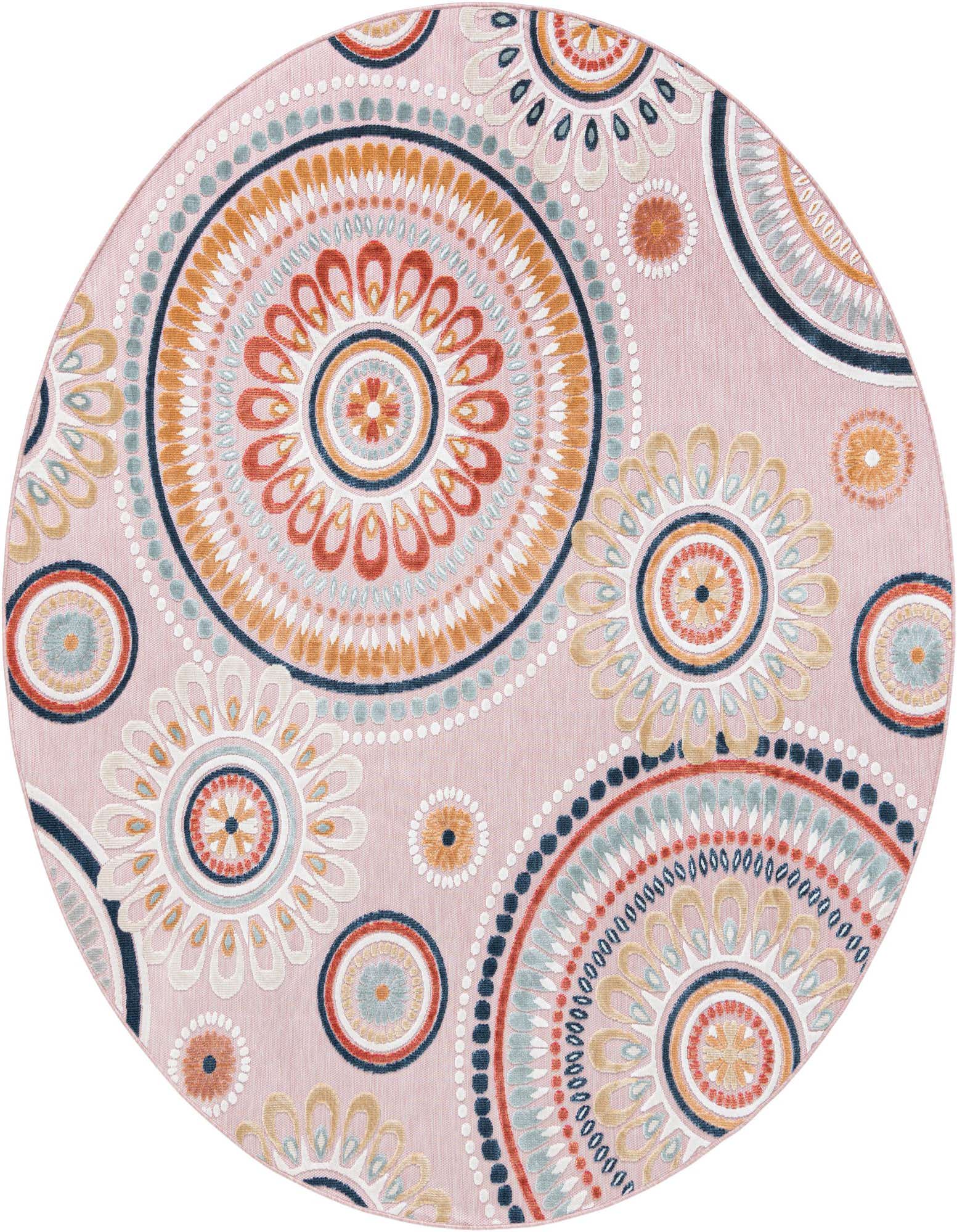 A round pink indoor/outdoor rug with a modern abstract pattern of large, colorful mandalas in orange, blue, and white.