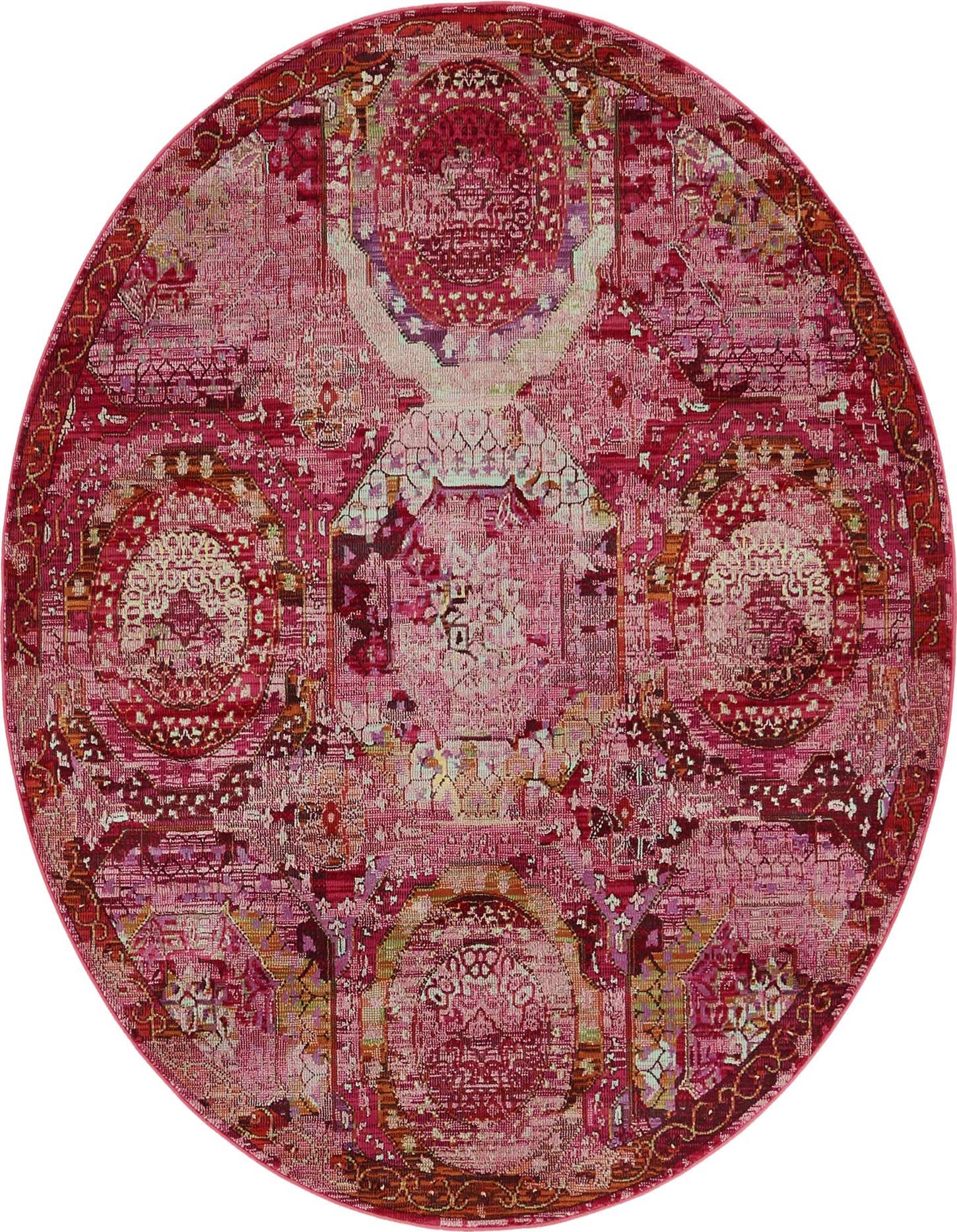 A 5' 5 round pink area rug featuring a distressed modern medallion and bohemian pattern.