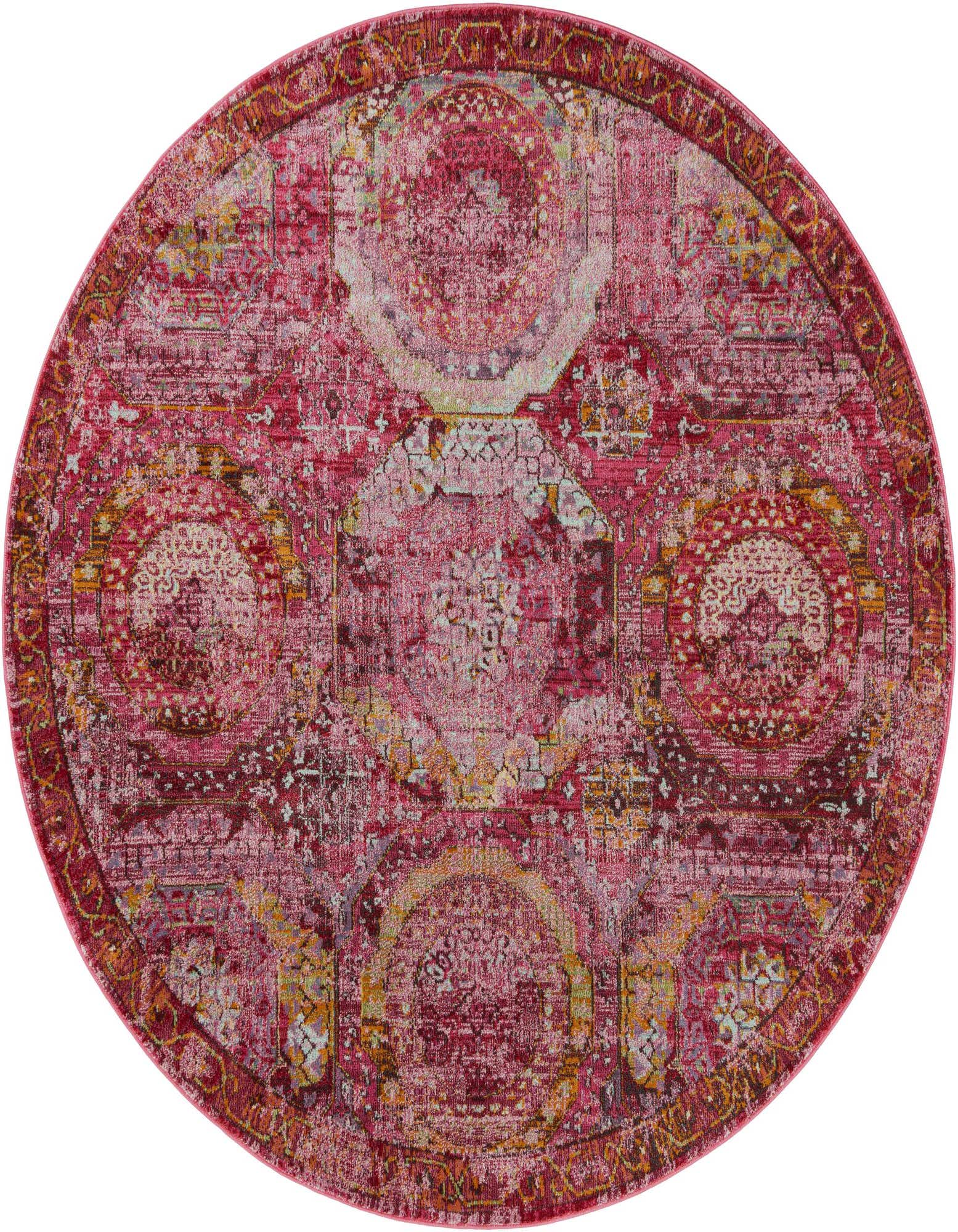 A 7' round pink Bohemian rug with a distressed medallion pattern in shades of pink, cream, and gold.