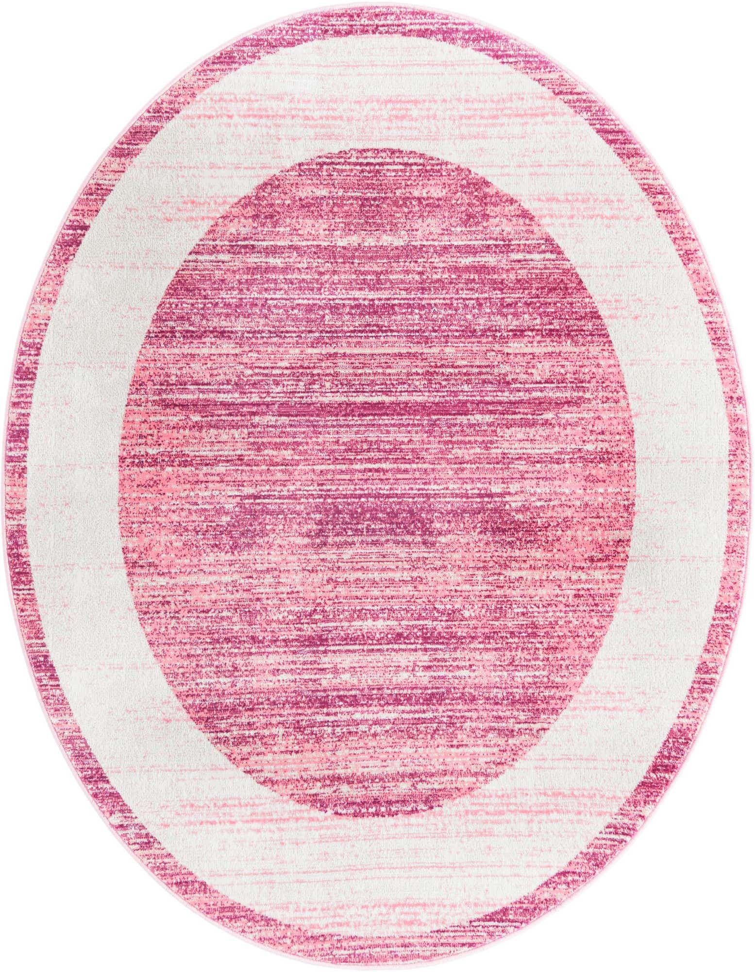 A 5' 3 round pink contemporary area rug with a textured surface and a light pink border.