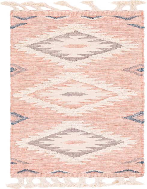 A pink 8 ft runner rug with a bohemian tribal pattern featuring cream shag diamonds and blue accents, with tassels.