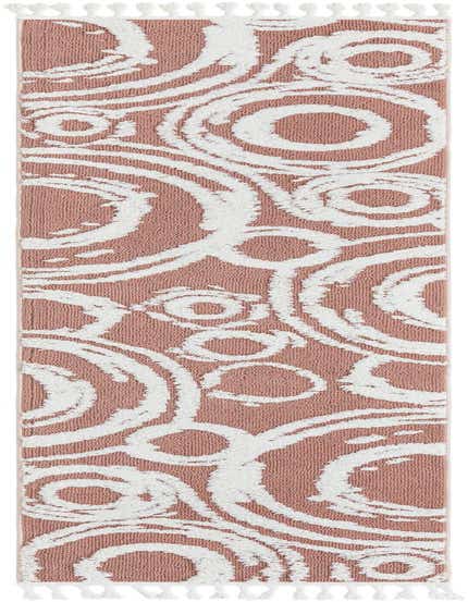 A 12 ft pink runner rug with a modern abstract white concentric circle pattern and white tassels.