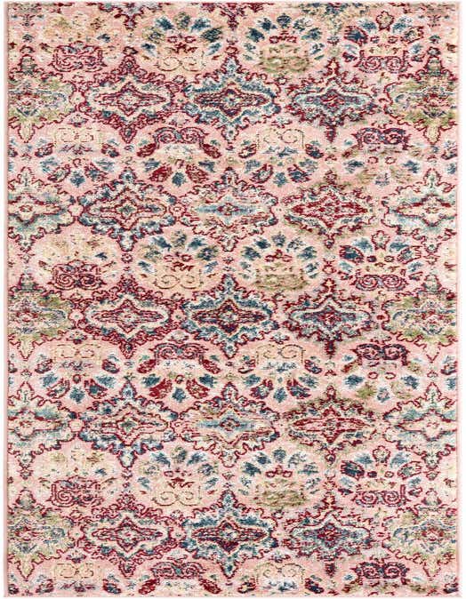 A 10 ft runner rug in shades of pink, red, and blue with a distressed transitional floral and tribal pattern, ideal for a hallway.