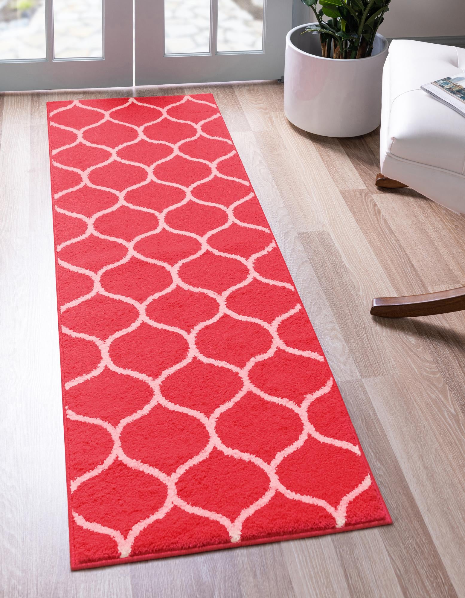A vibrant pink 6 ft runner rug with a repeating off-white modern trellis pattern, ideal for a hallway or kitchen.