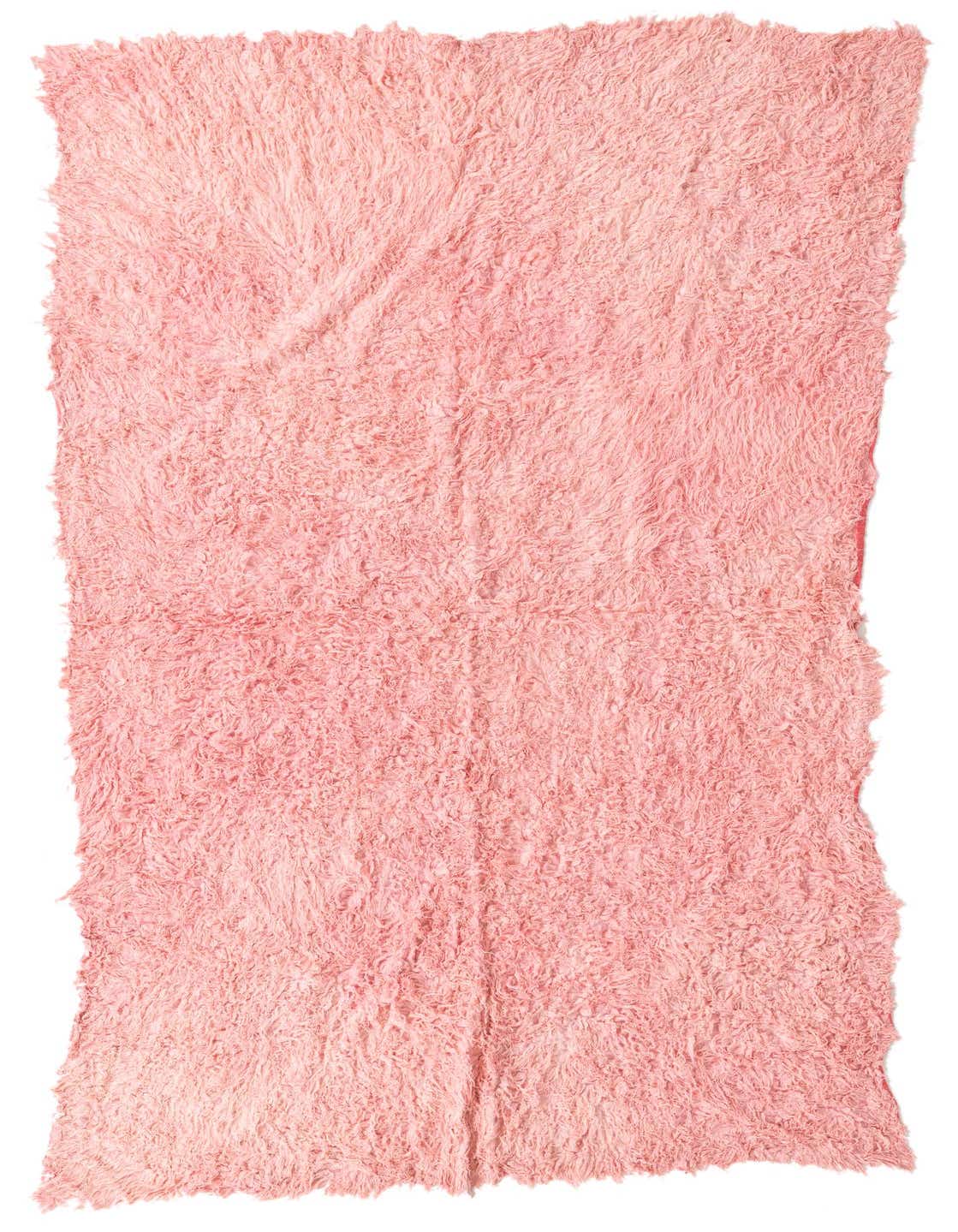 A plush, handmade 8 ft pink shag runner rug from the Moroccan collection, perfect for a hallway.