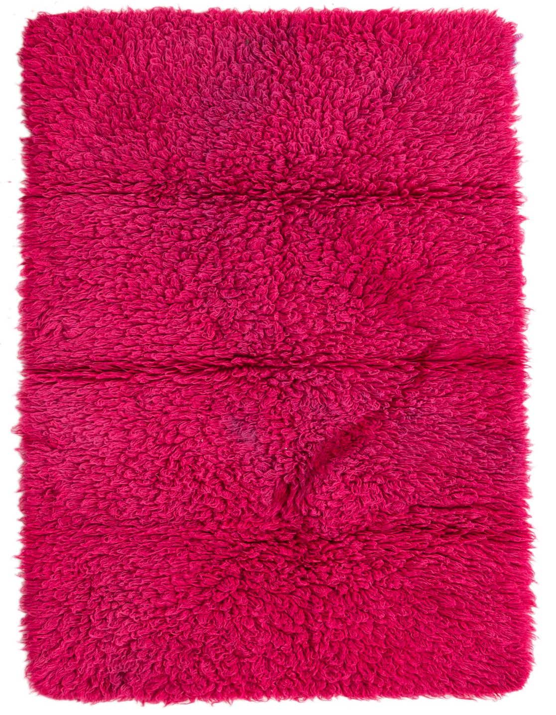 A vibrant pink 6 ft runner rug with a plush, shaggy texture, perfect for a hallway.