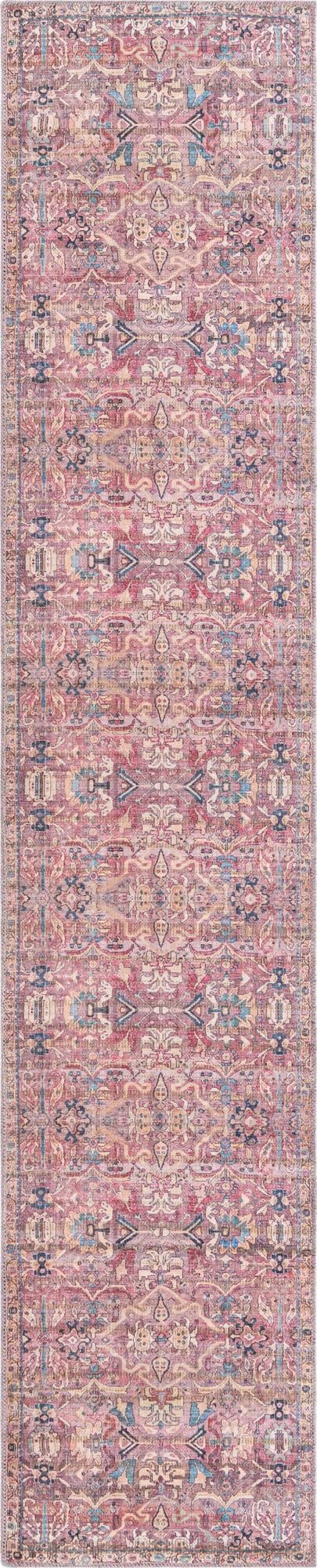 A 10 ft runner rug in pinks with a distressed traditional tribal floral pattern, ideal for a hallway.