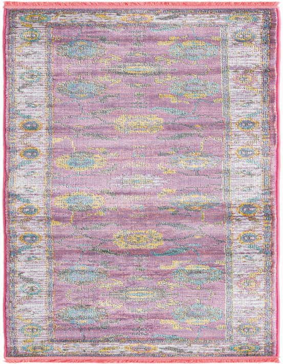 A long 8 ft runner rug in shades of pink, featuring a distressed traditional medallion pattern with hints of yellow and blue, ideal for a hallway or kitchen.