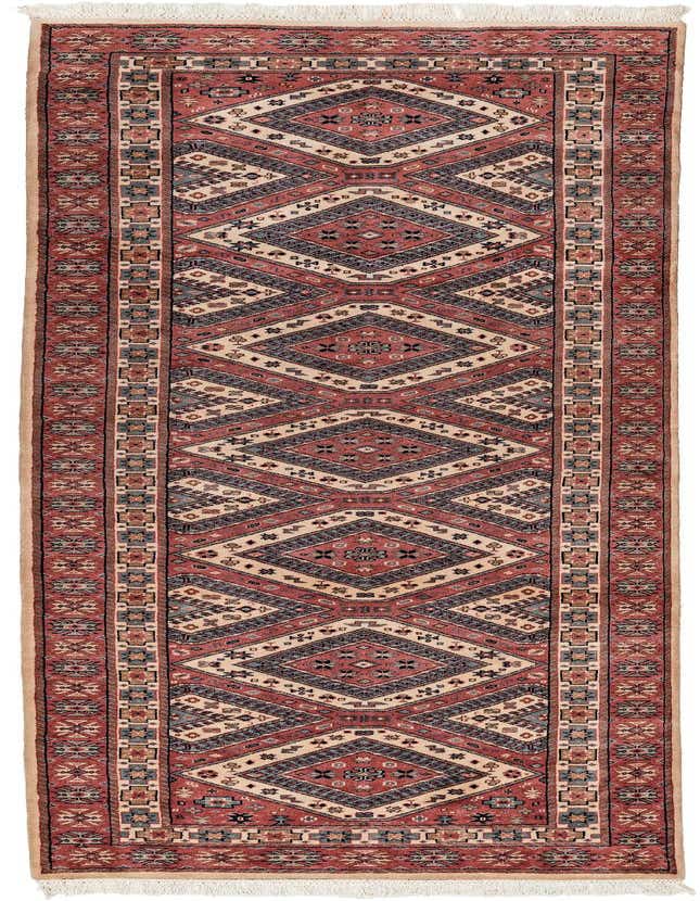 A 10 ft runner rug with a traditional tribal pattern in shades of pink, cream, and blue, featuring large central diamonds and intricate borders, ideal for a hallway.