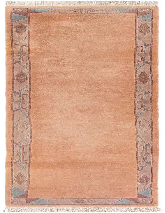 A handmade 11 ft pink wool runner rug with a modern oriental border pattern, perfect for a hallway.