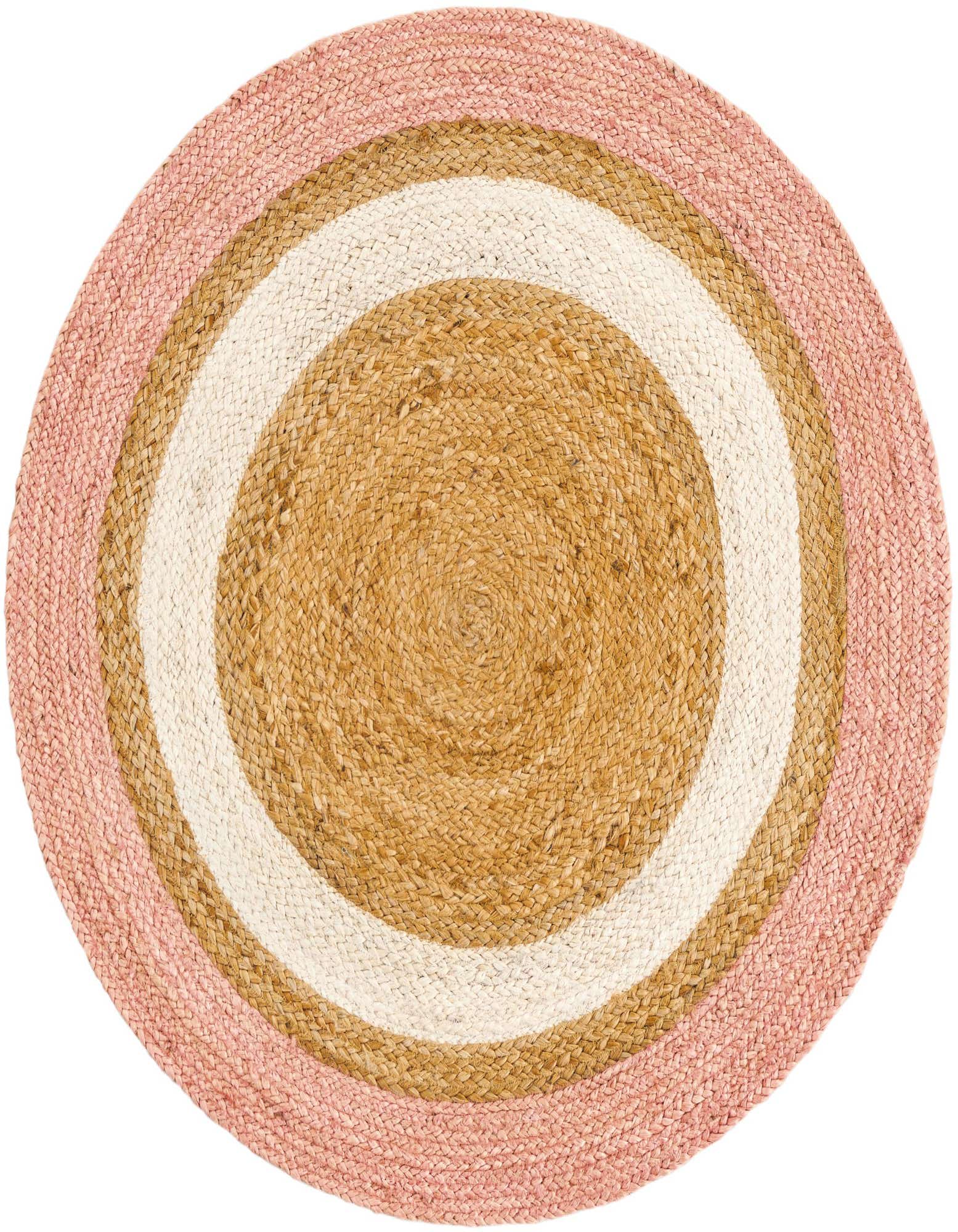 A round braided jute rug featuring concentric circles in natural brown, cream, and a soft pink border.