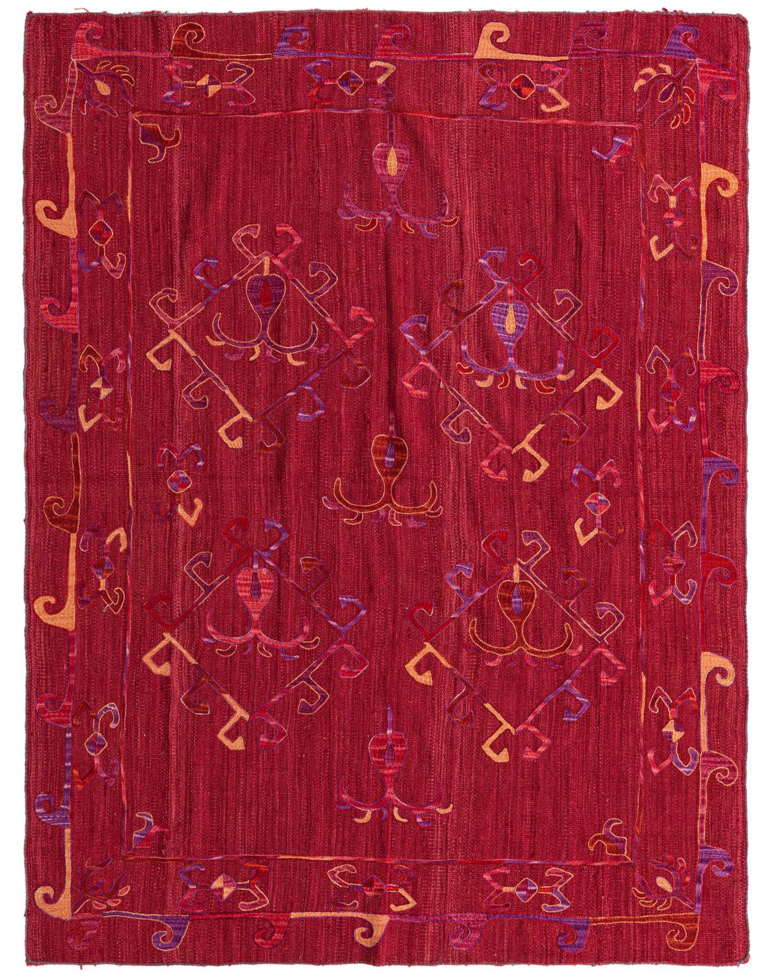 A 5x8 rectangular Kilim Suzani rug featuring a vibrant red background with intricate tribal and abstract patterns in shades of purple, red, and orange.