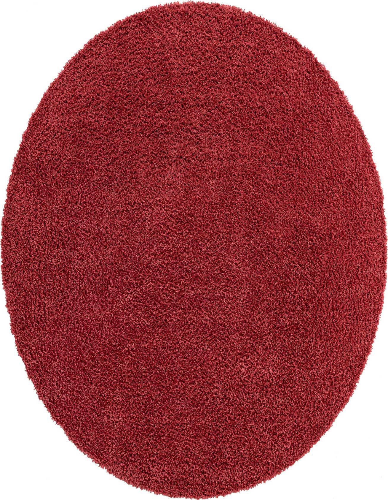 A plush, round red shag rug with a textured pile, ideal for adding warmth and color to any indoor space.