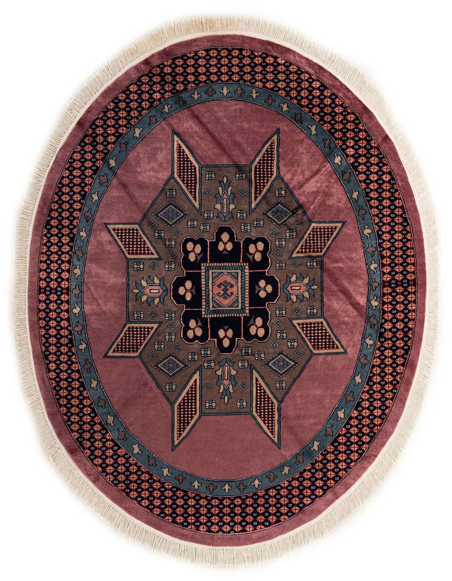 A 6' round purple Bokhara wool rug with a central medallion in tribal, traditional, and oriental patterns, featuring shades of blue, brown, and black, with a fringe border.