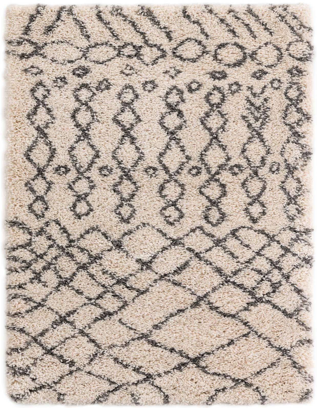 A 3x5 rectangular ivory shag rug with a modern tribal trellis pattern in dark gray, perfect for a cozy living room.