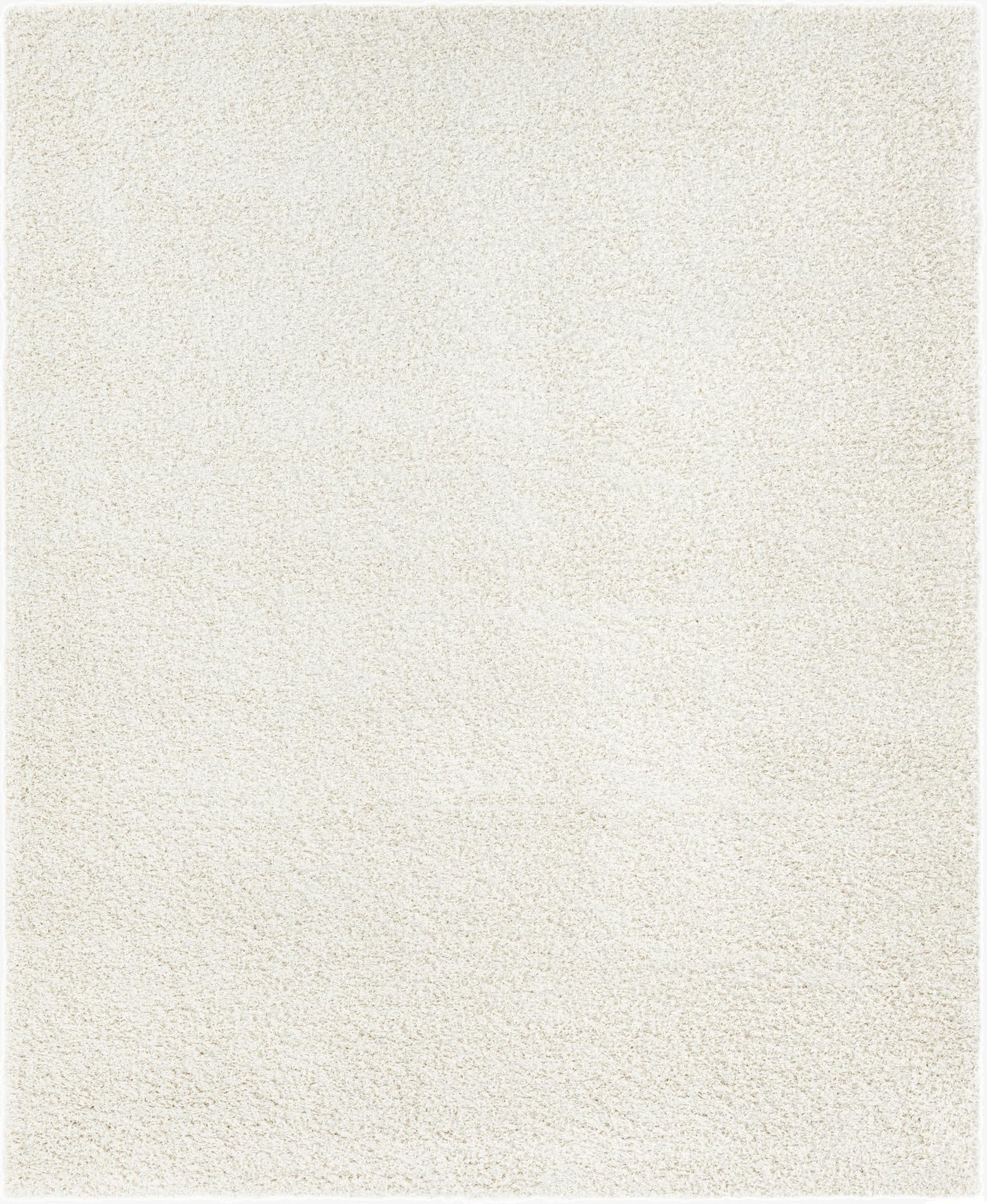 A soft, plush 8x10 rectangular ivory shag rug, perfect for a modern living room or bedroom.