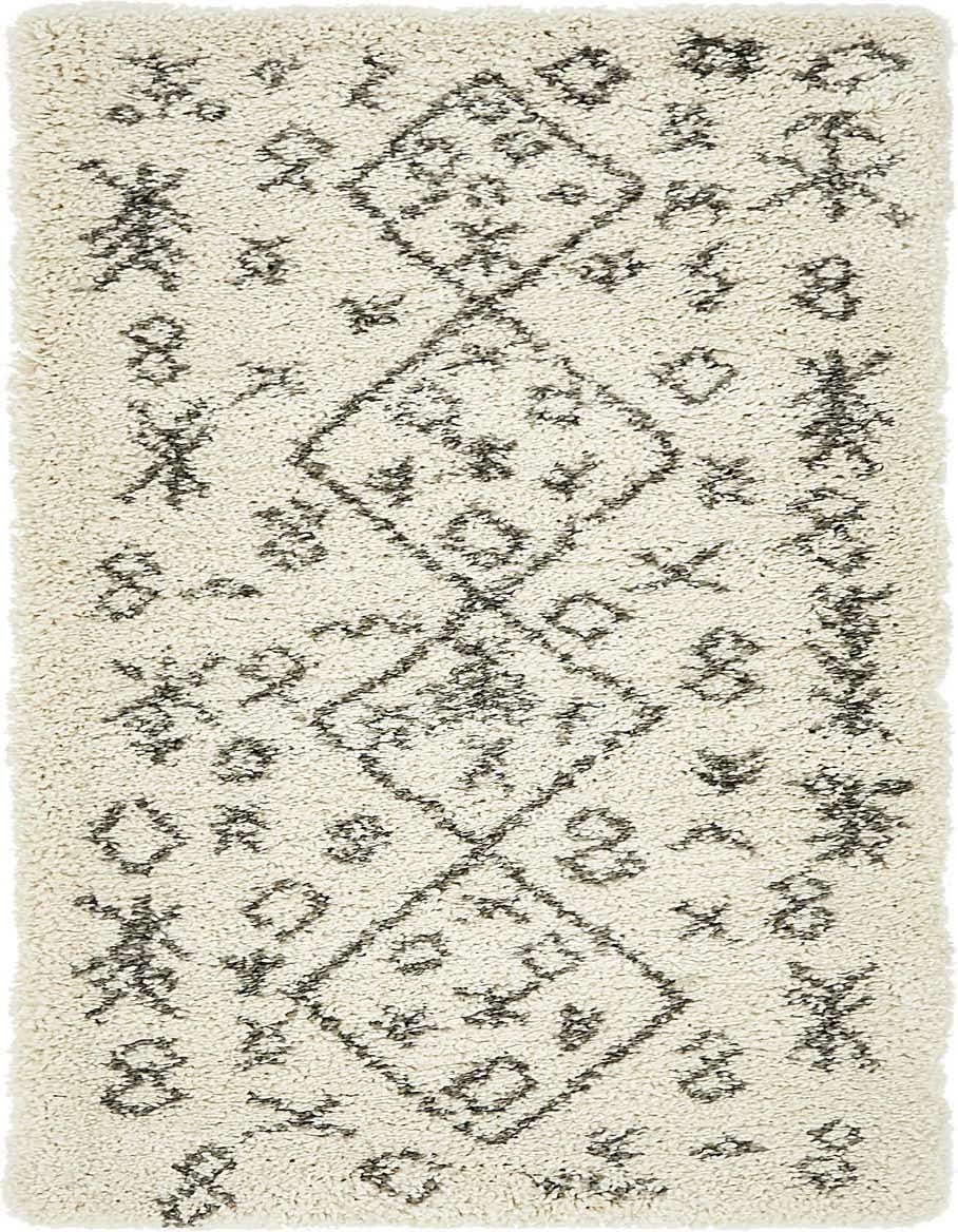 A 6 ft runner rug with a thick ivory shag pile and a modern tribal pattern in charcoal gray, perfect for a hallway.