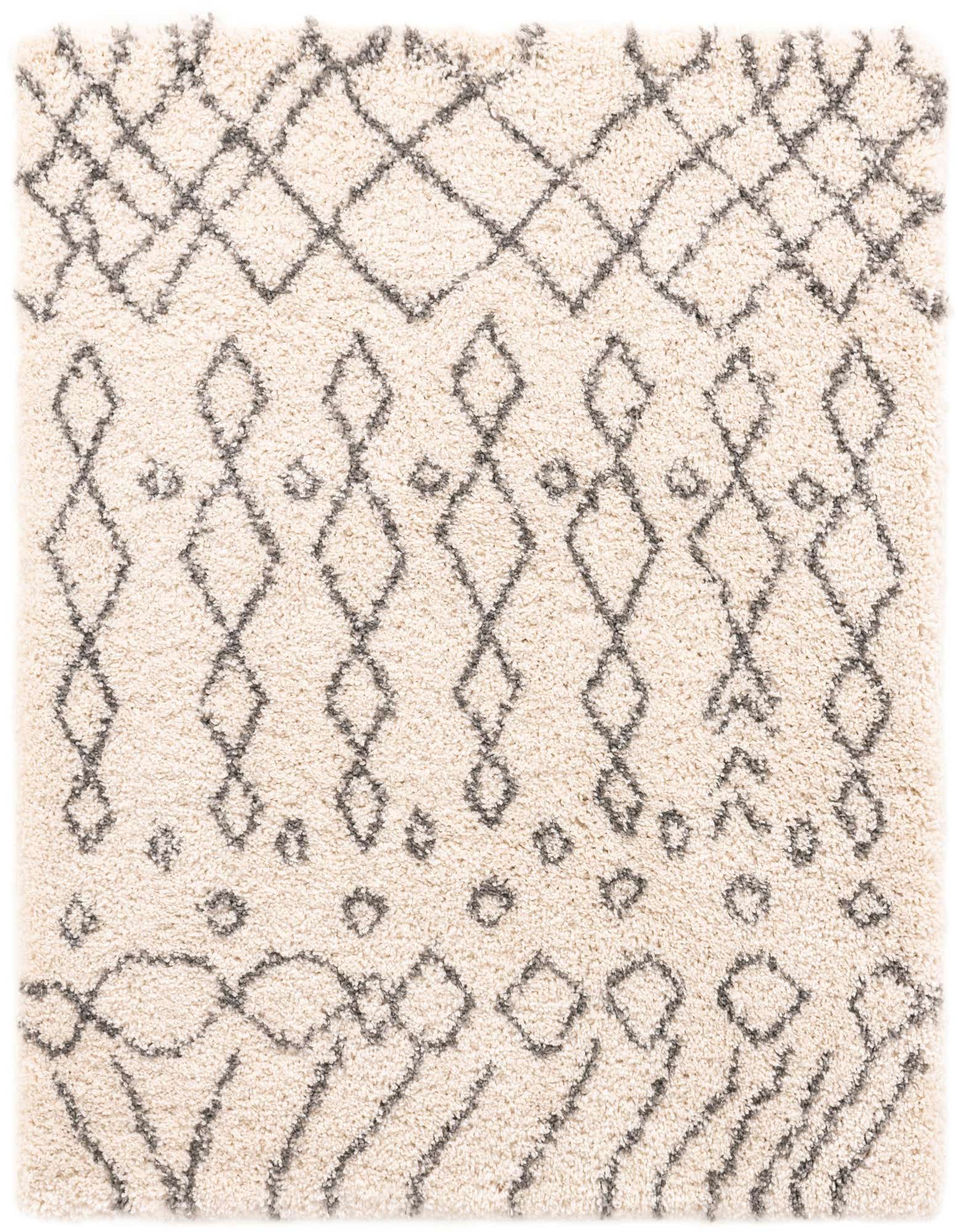 A 5' 3 x 5' 3 square ivory shag rug with a modern tribal trellis pattern in dark gray, showcasing its plush texture.