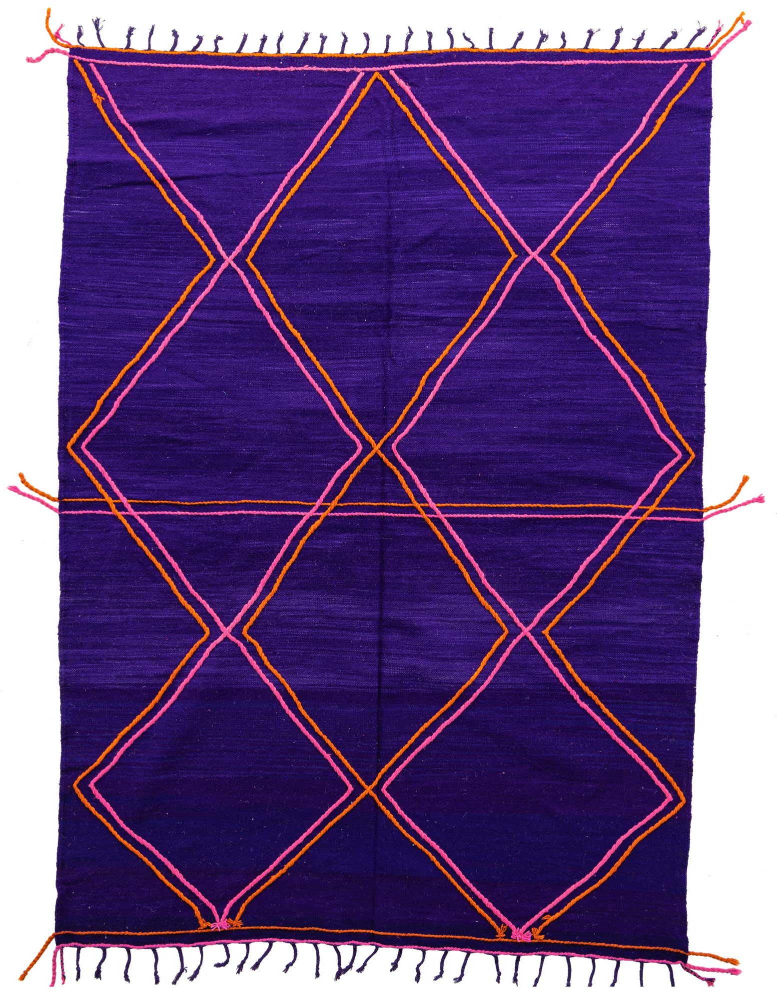 A 7x10 rectangular purple shag rug with a bold, modern tribal diamond pattern in pink and orange.
