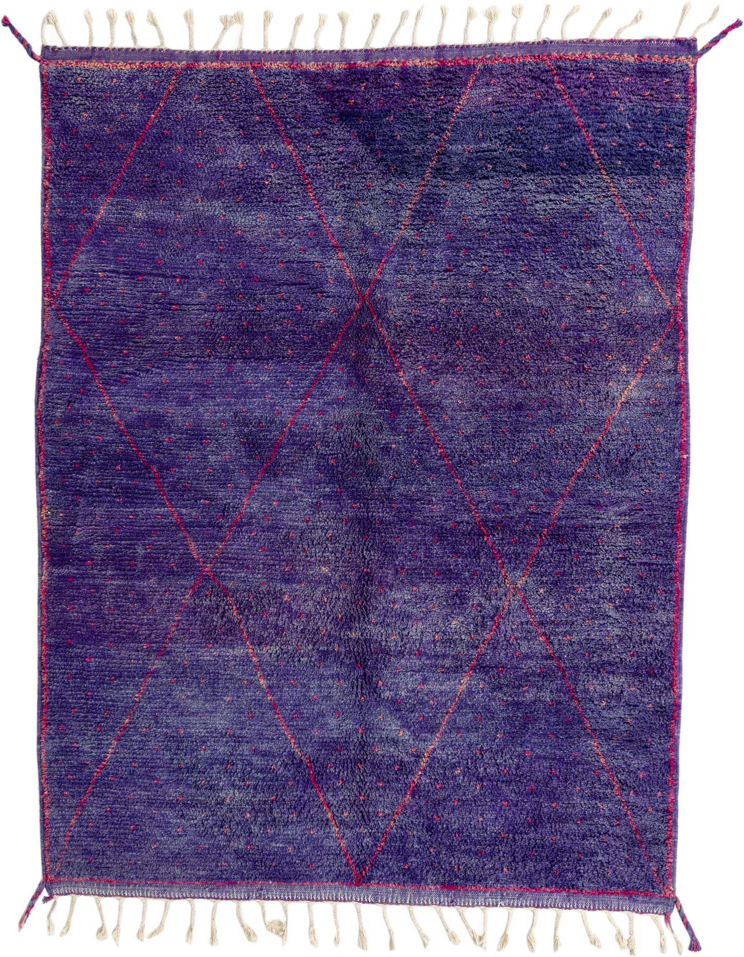 A 6x9 rectangular purple shag rug with a red tribal diamond pattern and white fringe, suitable for a living room.