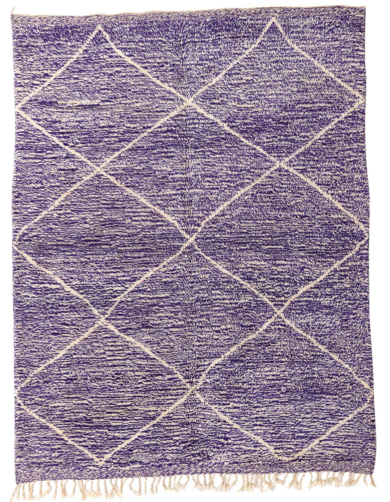 A 6x9 rectangular purple shag rug with an off-white tribal diamond pattern and fringed edges, suitable for a living room.
