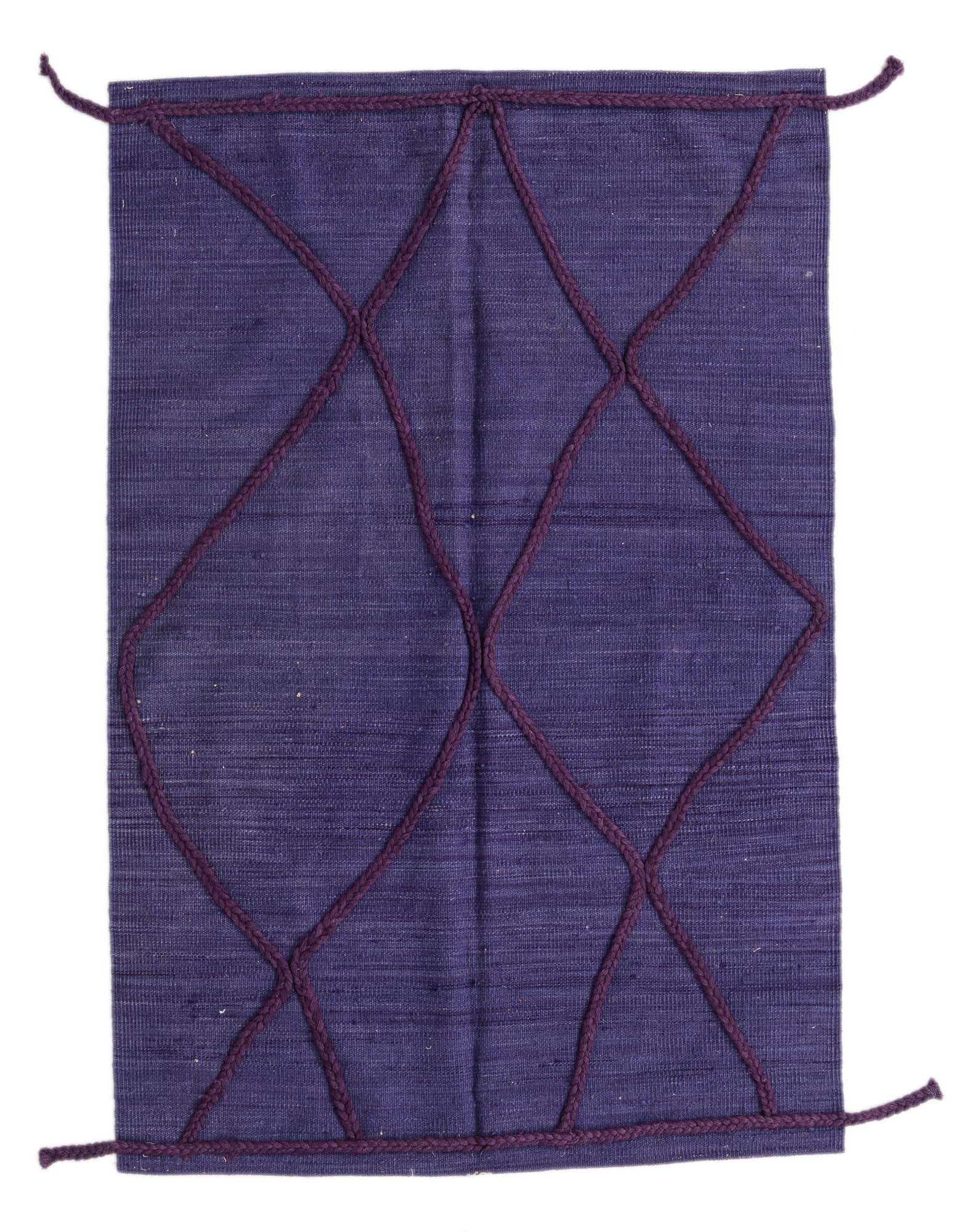 A 3x5 rectangular purple shag rug with a dark purple tribal diamond pattern, handmade from wool.