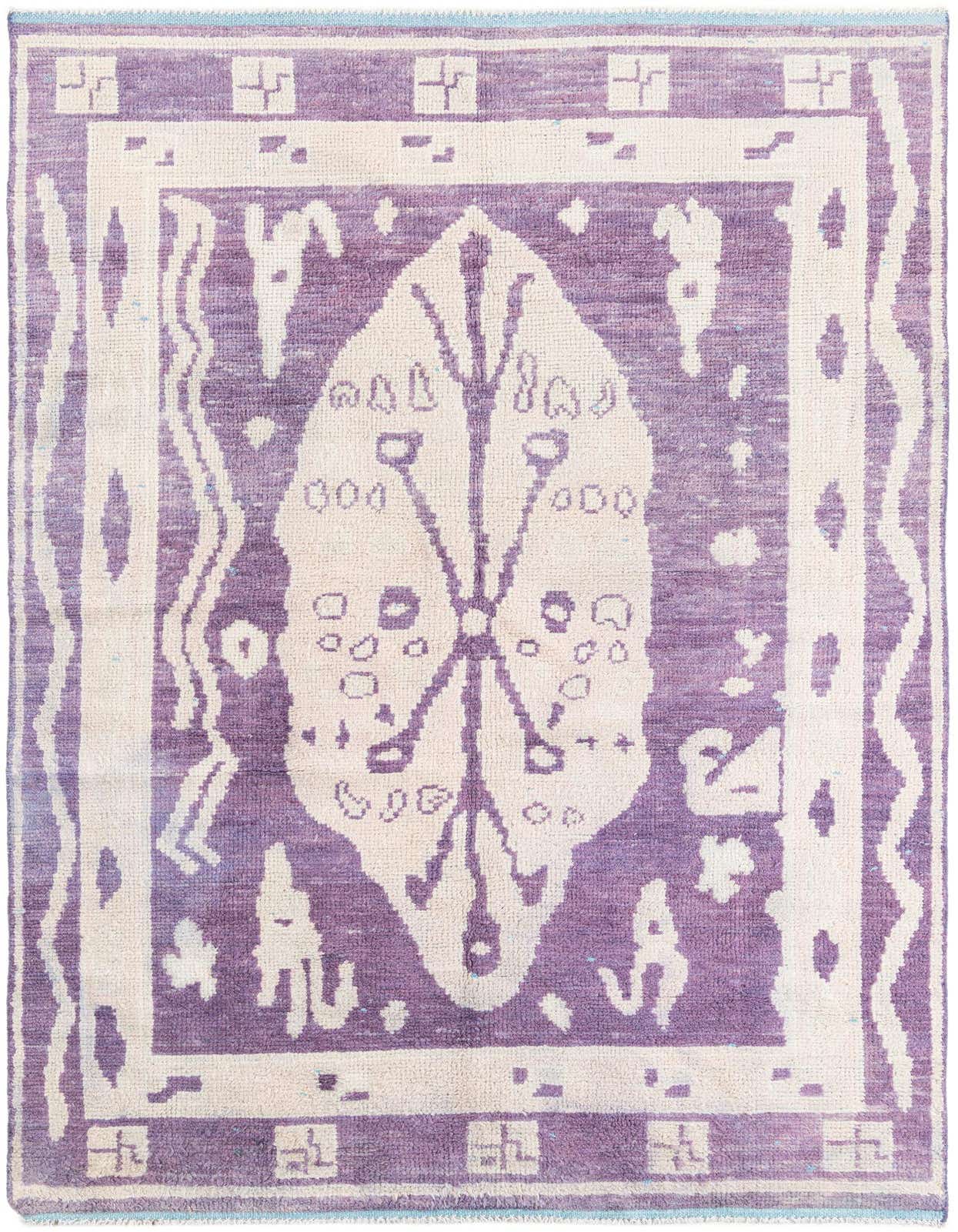 A 6x9 rectangular purple and cream Moroccan shag rug with a central tribal medallion and border.