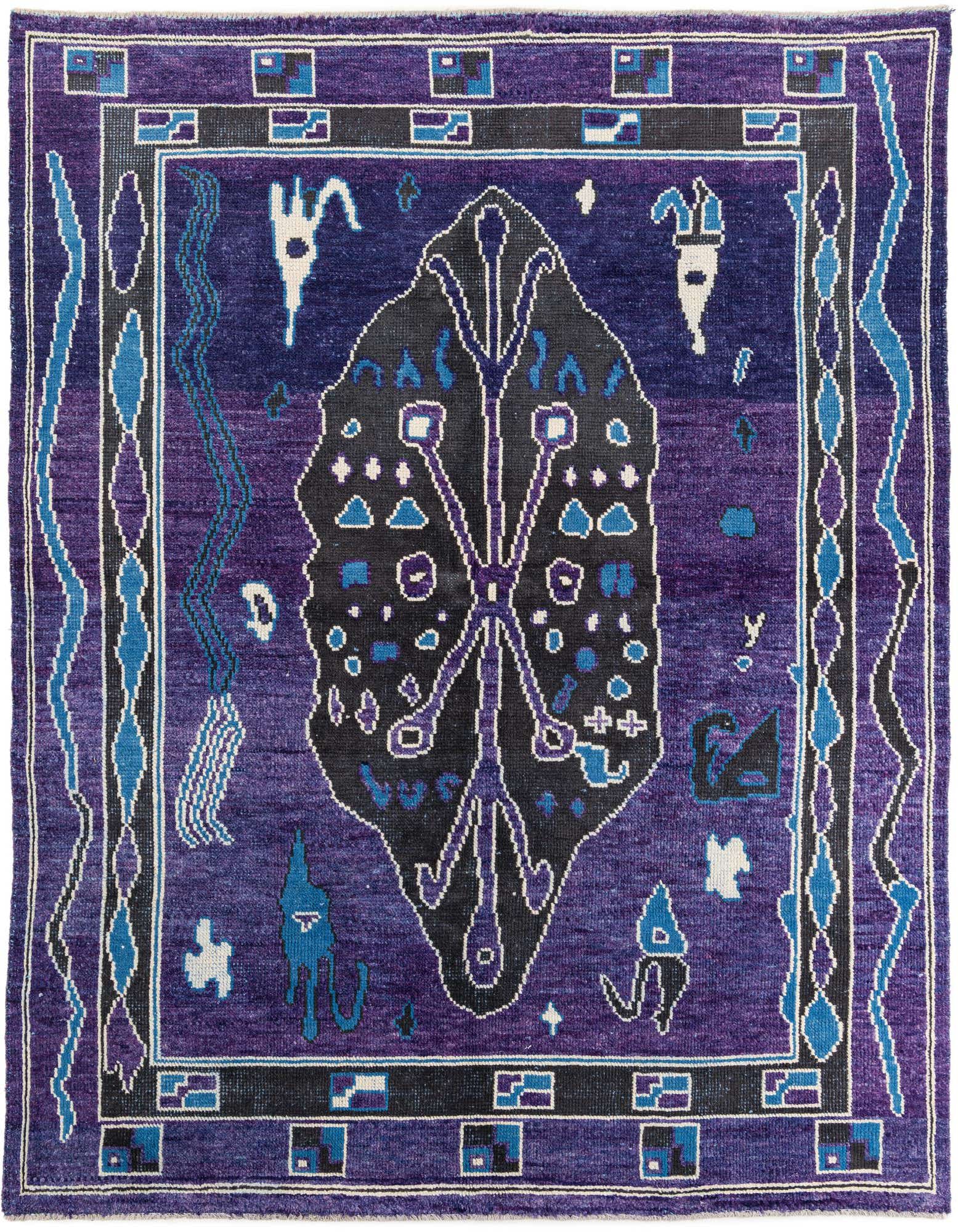 A handmade 8x10 rectangular purple wool shag rug with a central black medallion and tribal patterns.