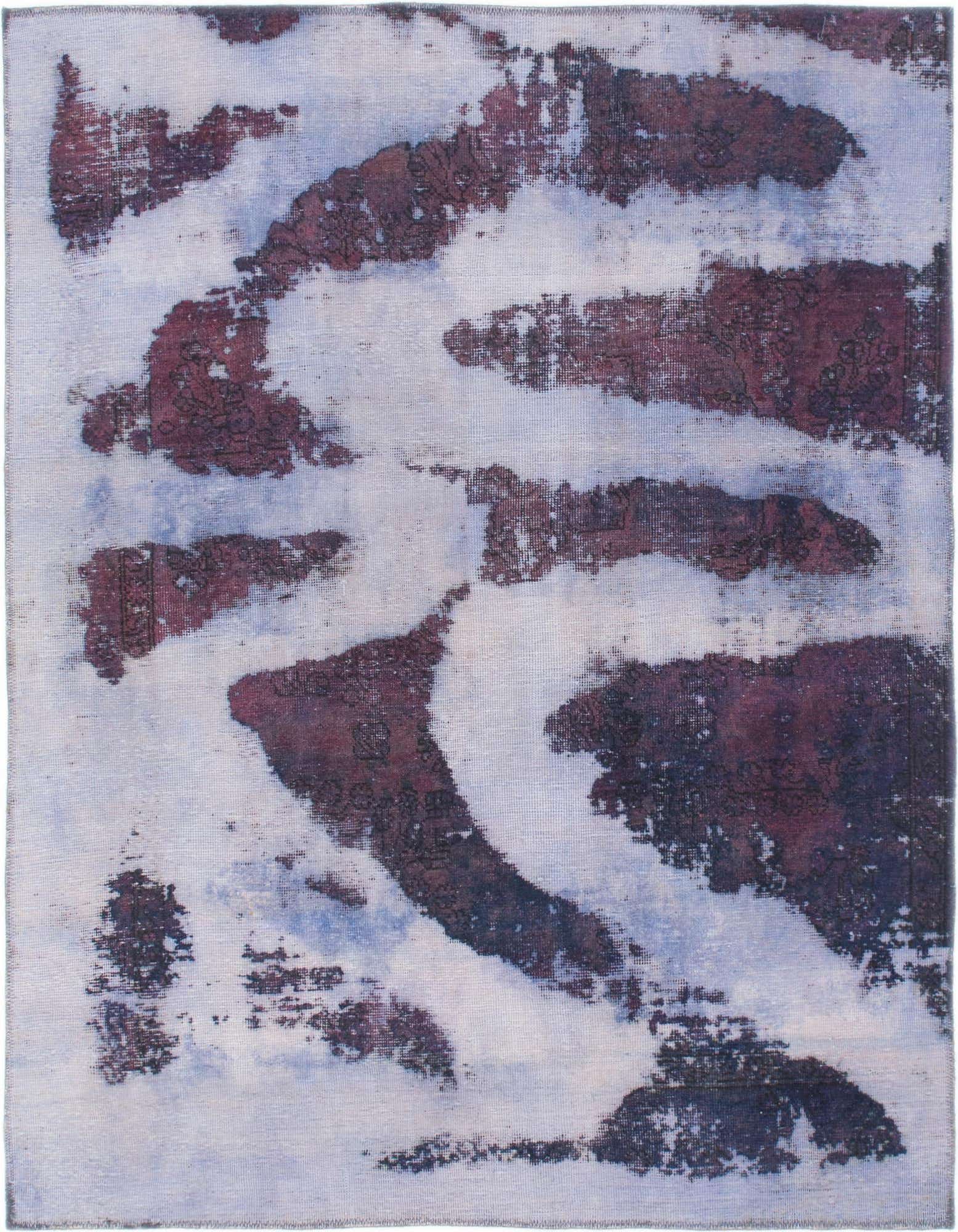A 5x7 rectangular purple wool rug with a distressed abstract pattern, featuring lighter purple and white tones.