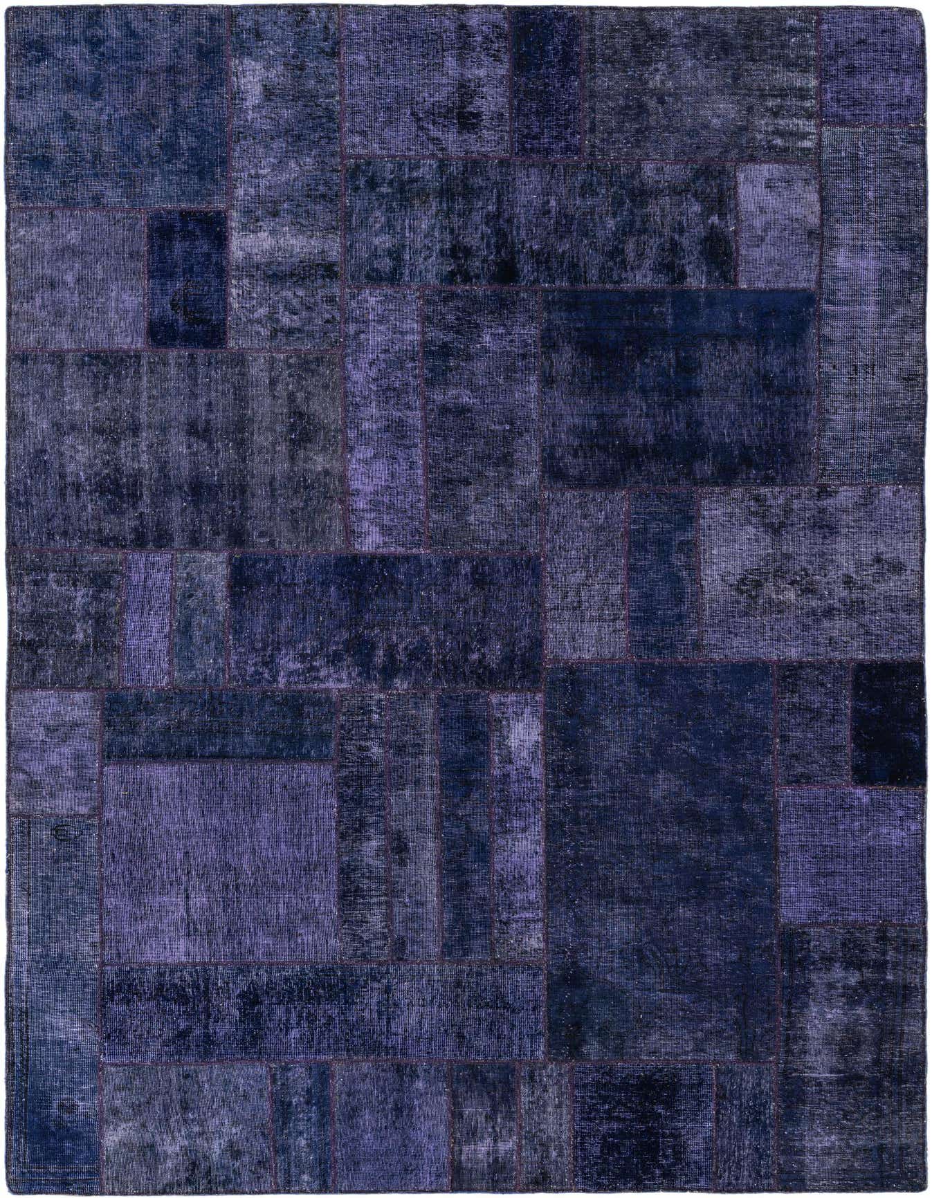 A 7x10 rectangular Ultra Vintage rug featuring a patchwork design in various shades of purple, made from 100% wool.