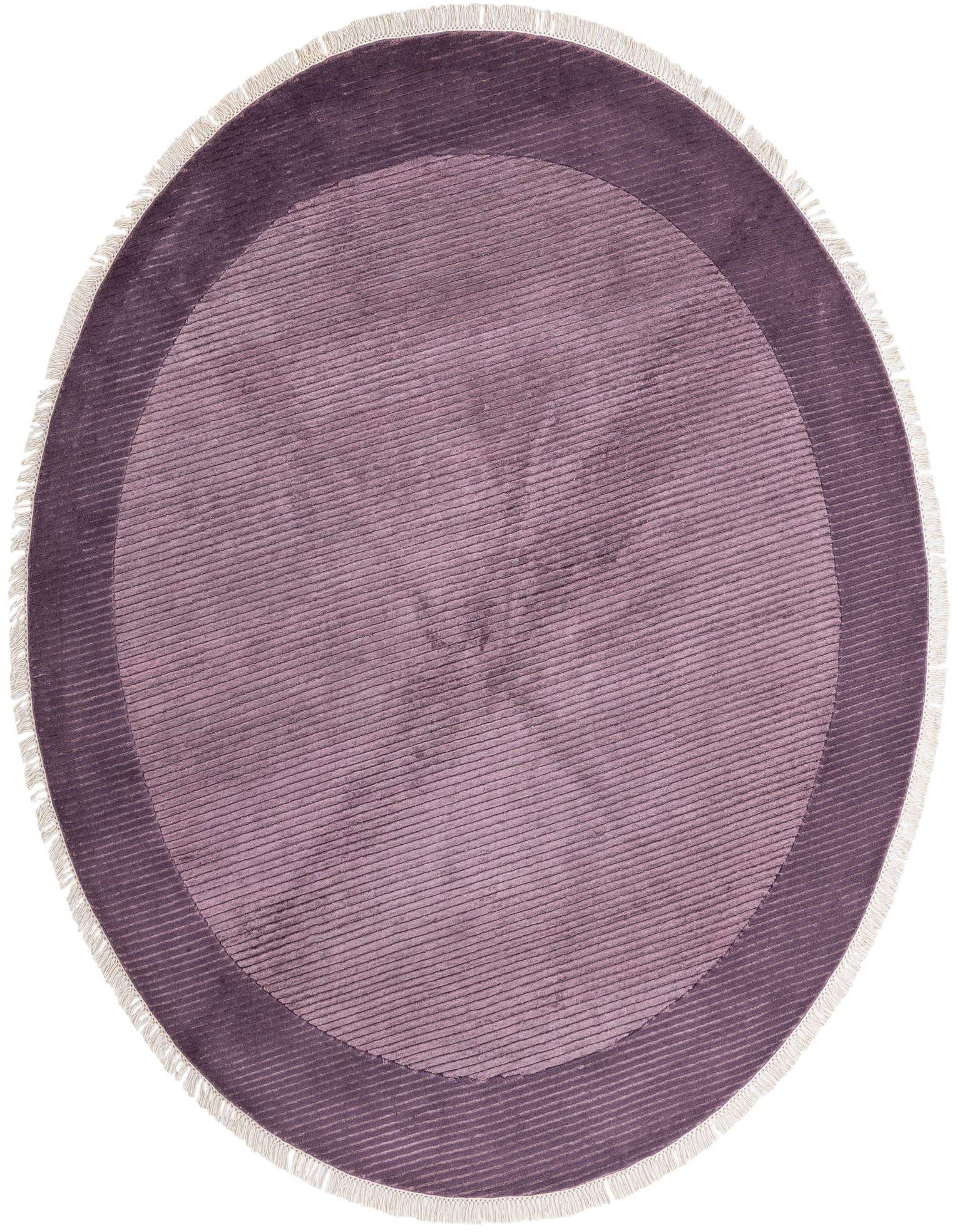 A 6' 7 round purple wool rug with a subtle striped texture and a darker purple border, featuring white fringe.
