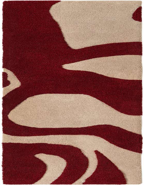 A high pile 8 ft runner rug with an abstract pattern of bold red and ivory cream wavy shapes.