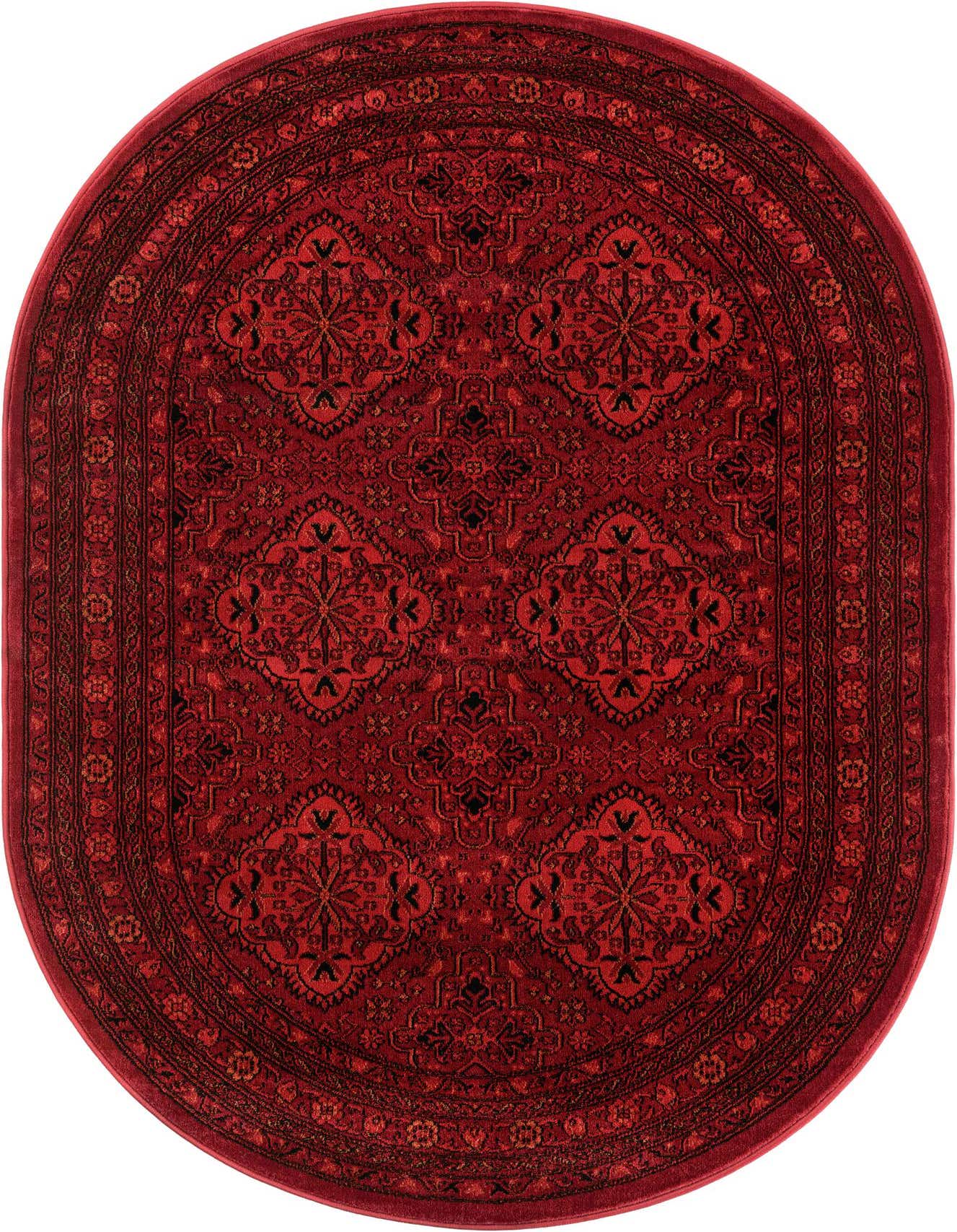 A 4' 1 x 6' 1 oval red traditional rug with a detailed black medallion and tribal pattern.