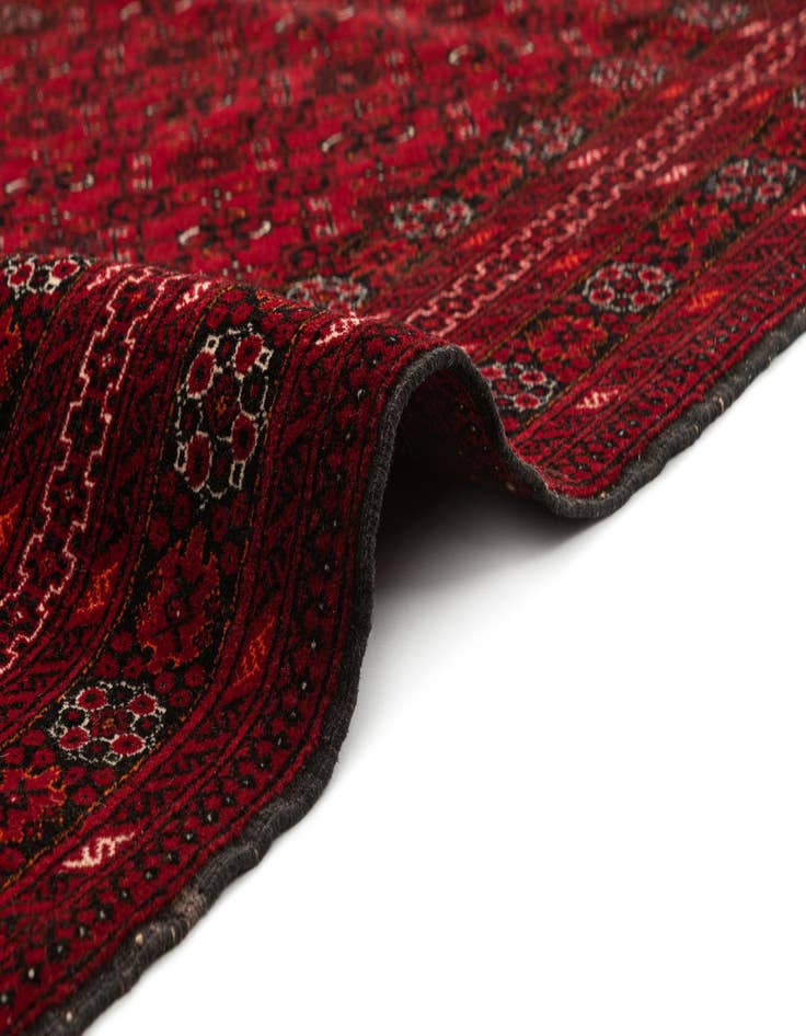 Detail image of  4' 3 x 6' 9  Hand Knotted Afghan Akhche Wool Rug