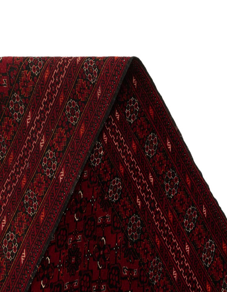 Detail image of  4' 3 x 6' 9  Hand Knotted Afghan Akhche Wool Rug