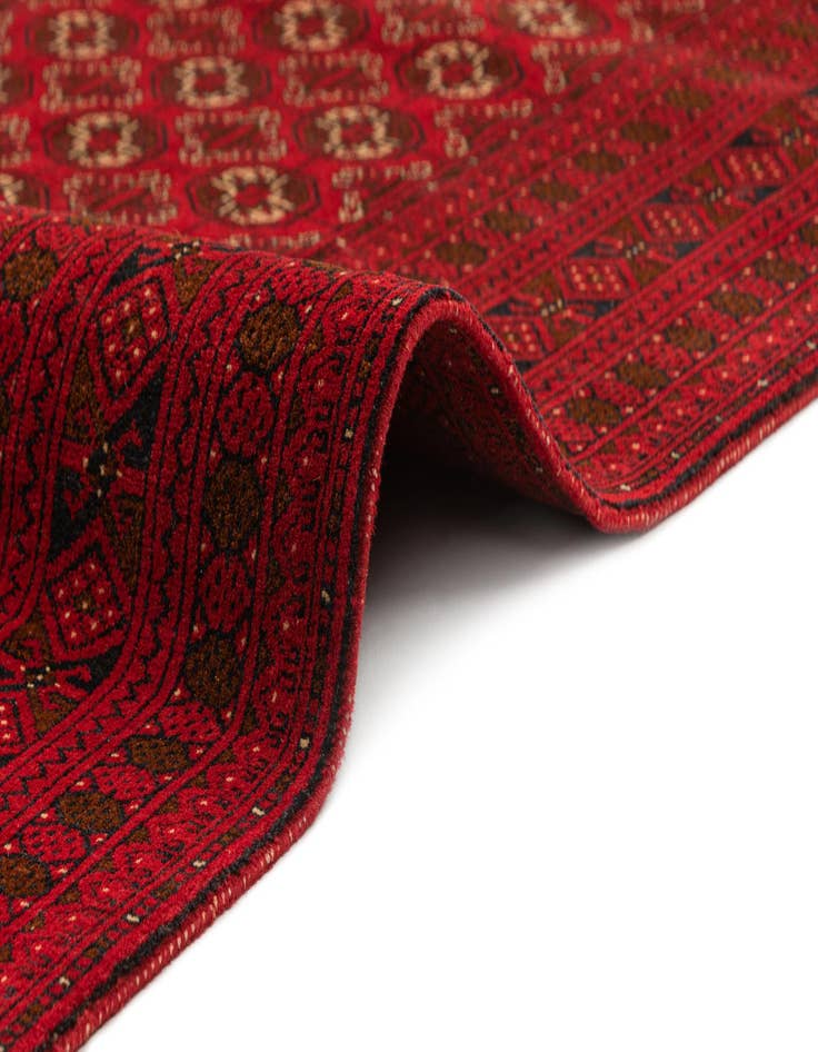 Detail image of  4' 2 x 6' 7  Hand Knotted Afghan Akhche Wool Rug