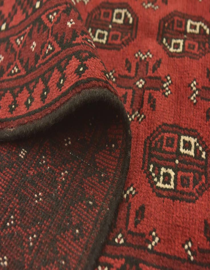 Detail image of  4' 10 x 6' 5  Hand Knotted Afghan Akhche Wool Rug