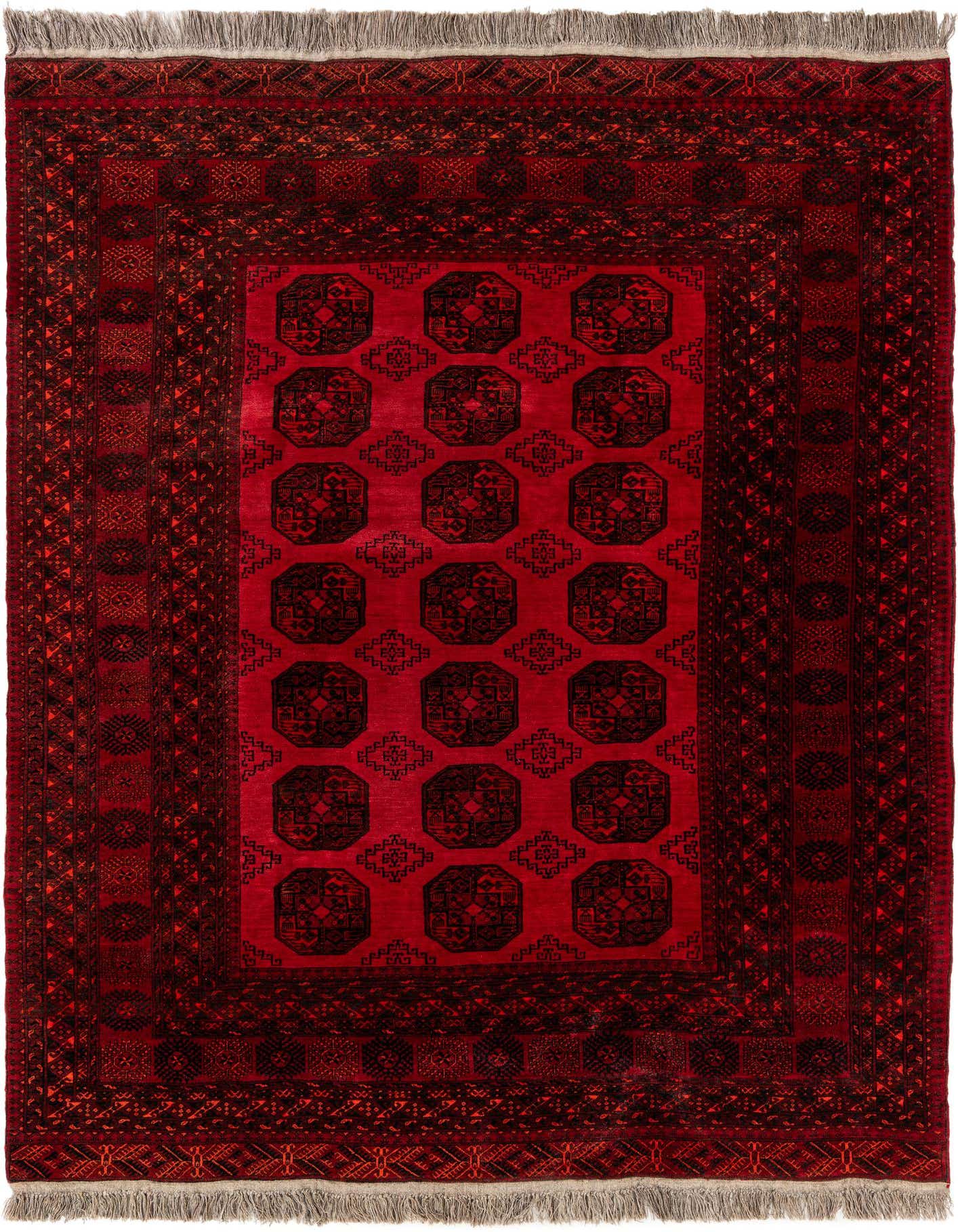 A 7x10 rectangular Rugs.com Afghan Akhche rug in deep reds with a traditional tribal pattern and fringe.