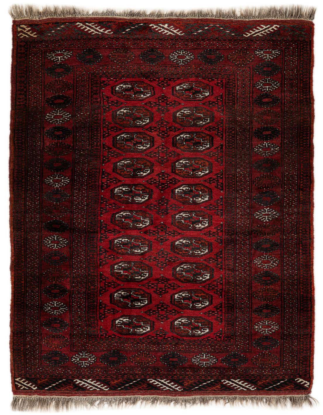 A 4x6 rectangular red tribal wool rug with a central pattern of repeating octagonal medallions and intricate borders, suitable for a living room.