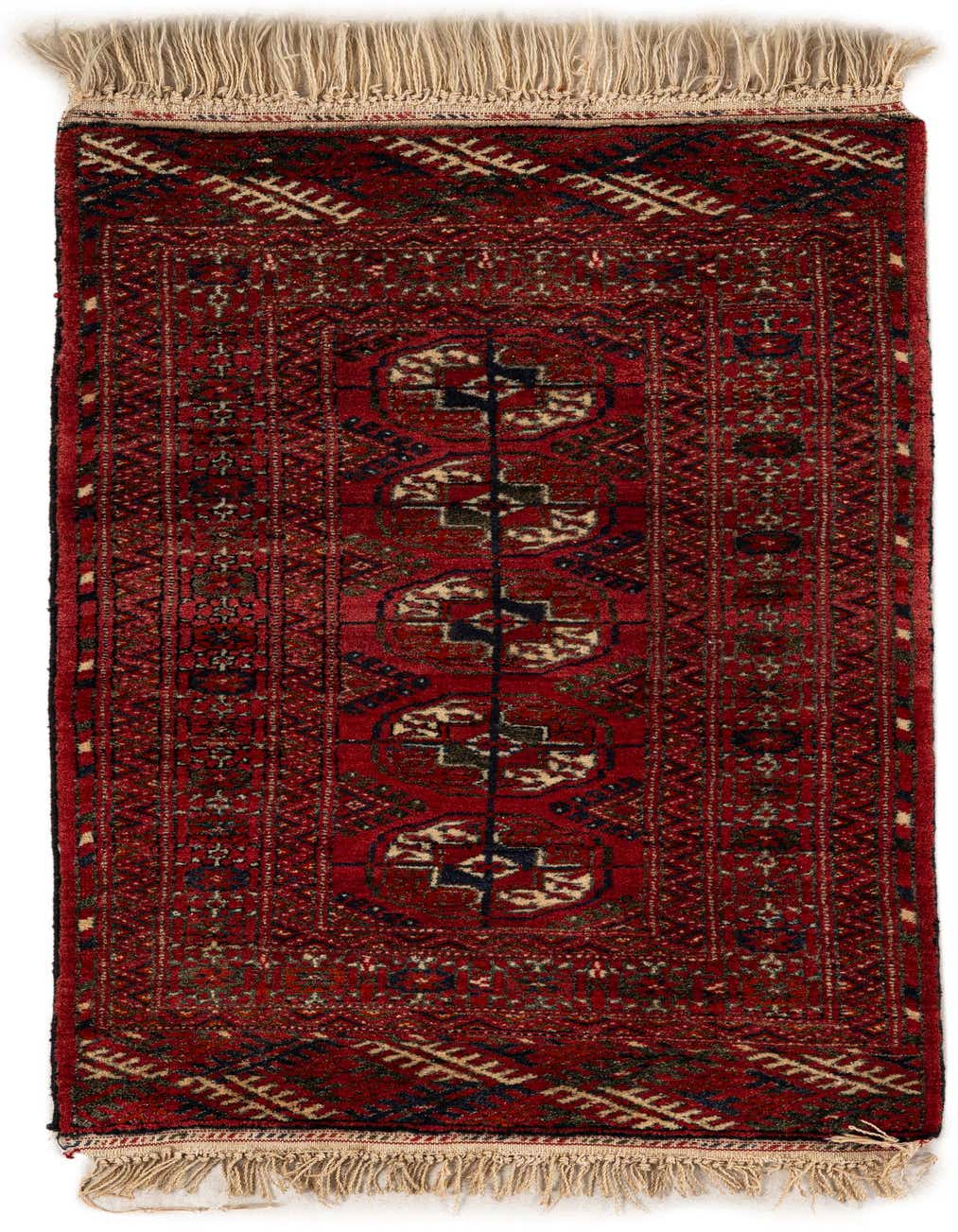 A 2x3 rectangular red tribal wool rug with intricate patterns and fringe, ideal for an entryway.