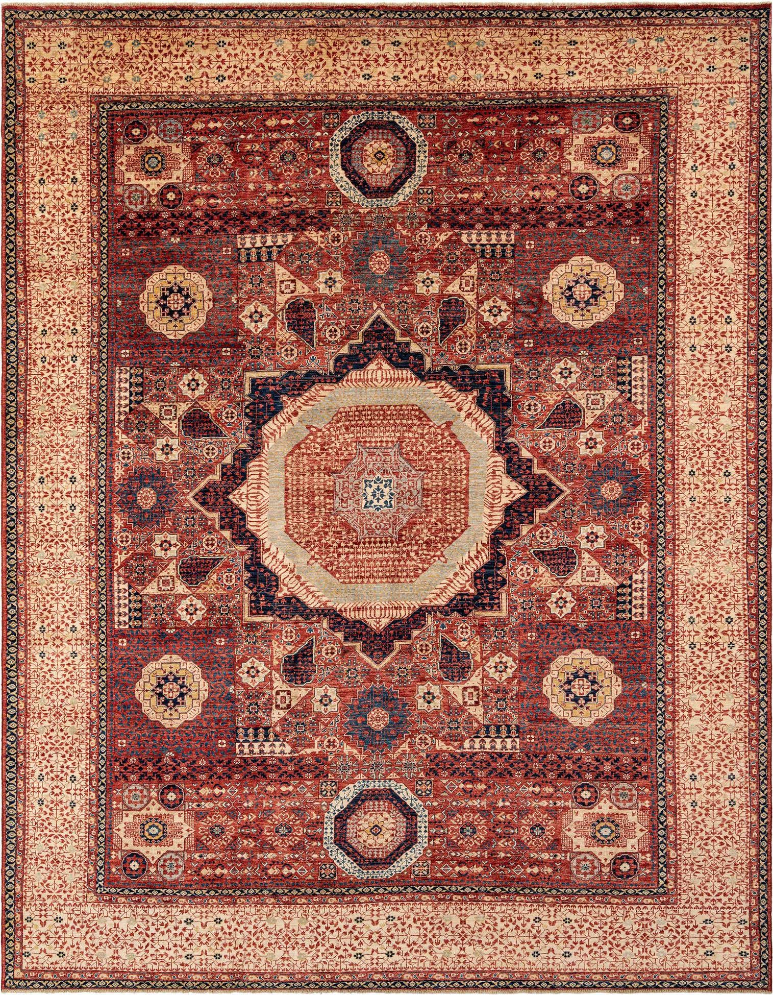 A rectangular handmade Persian rug with a rich red field and intricate geometric and floral patterns in navy, gold, and cream, featuring a prominent central medallion.