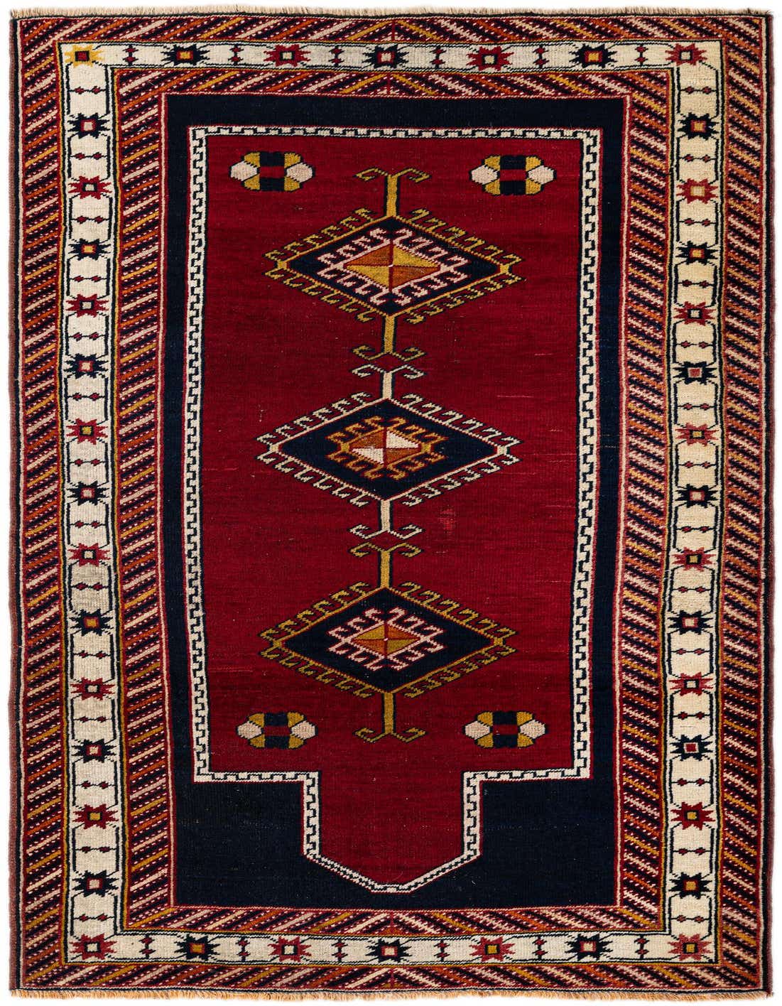 A 4x6 rectangular Anatolian wool rug featuring a deep red field with navy blue, gold, and cream traditional Oriental patterns.