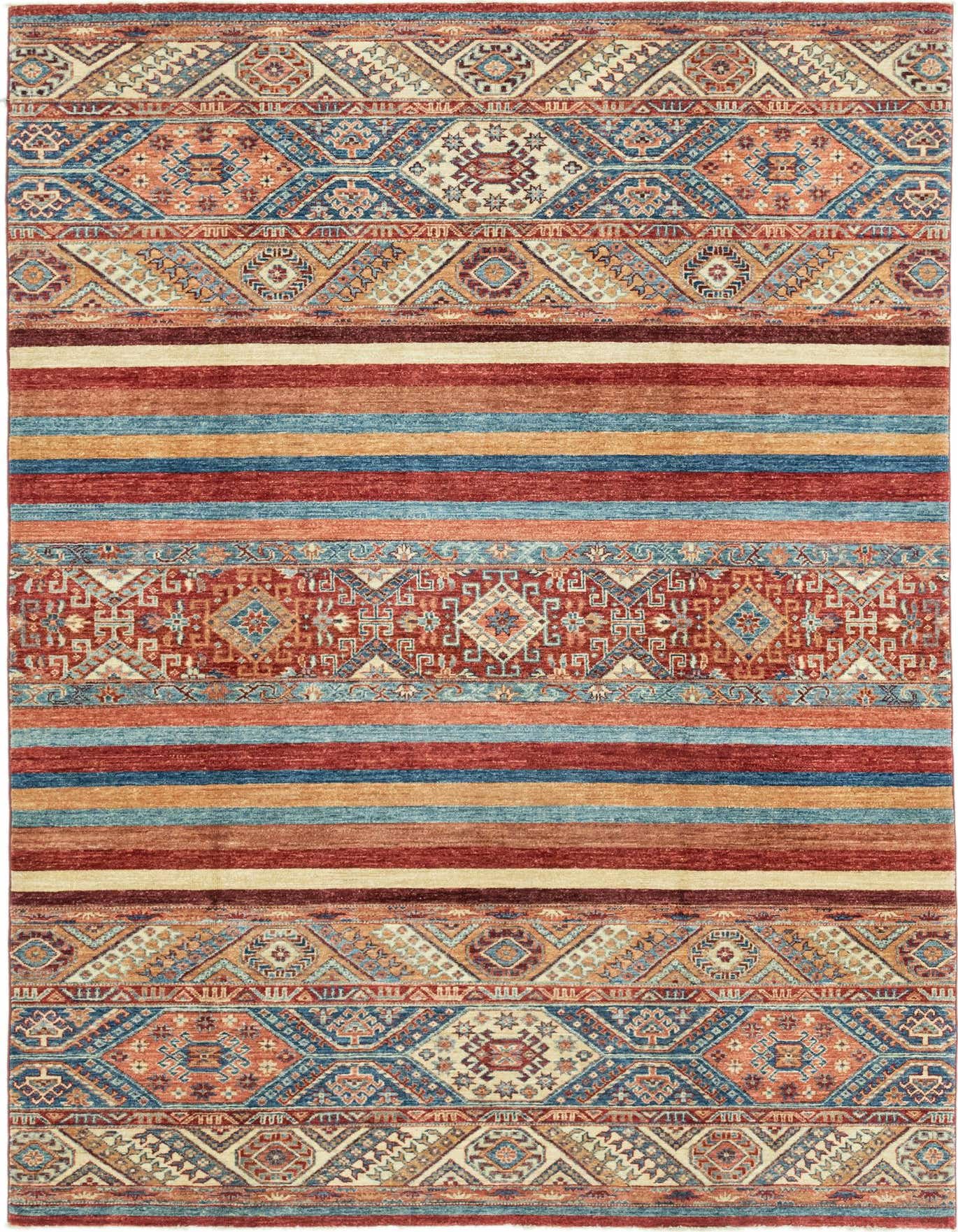 A 6x9 rectangular Ariana Ziegler rug featuring traditional Oriental patterns in reds, blues, and creams, with bold horizontal stripes.