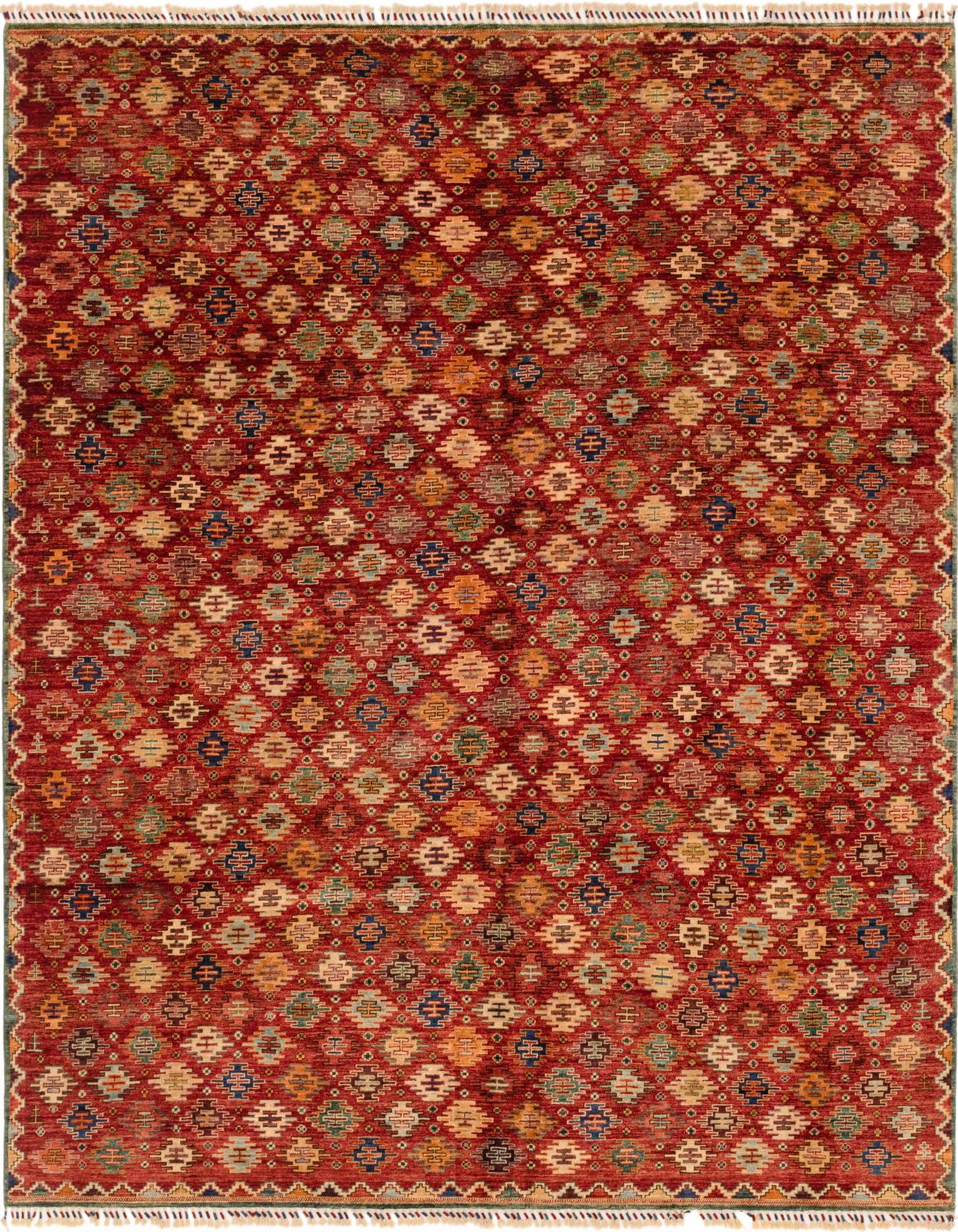 A 9x12 rectangular Ariana Ziegler rug featuring a Southwestern tribal pattern in various shades of red, beige, blue, and green.
