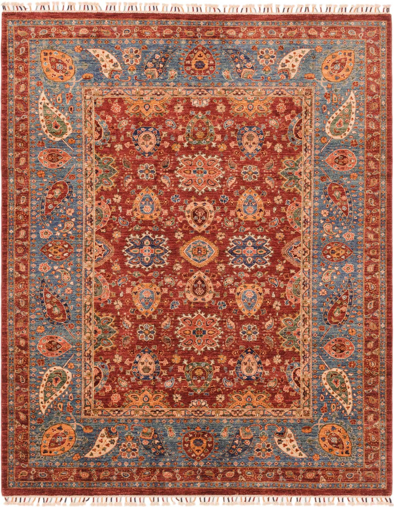 A 7x10 rectangular Ariana Ziegler rug featuring a rich red field with intricate traditional and tribal patterns, bordered by a detailed blue design, suitable for a living room.